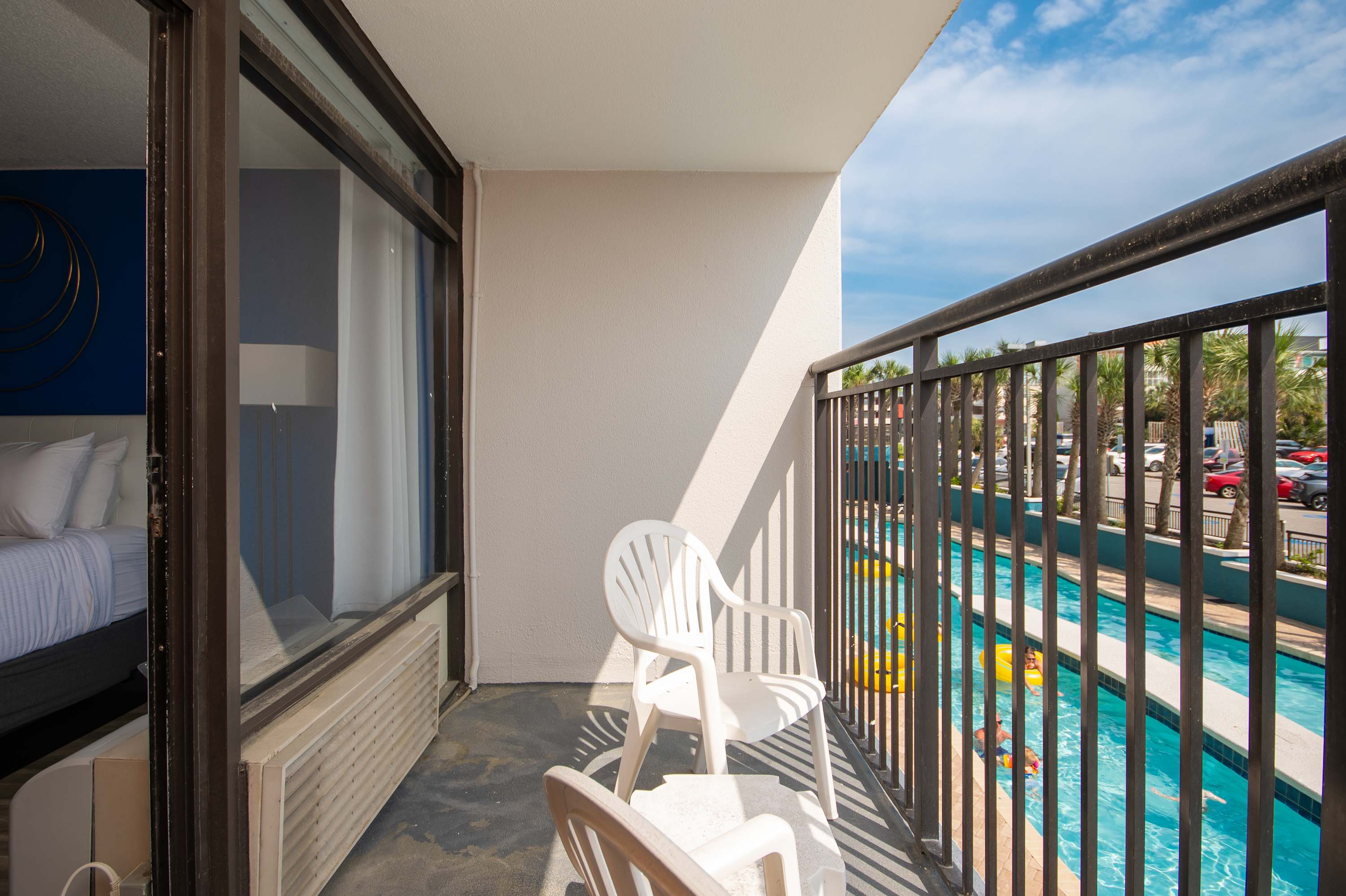 Feel connected to the fun with this relaxing pool-view balcony.
