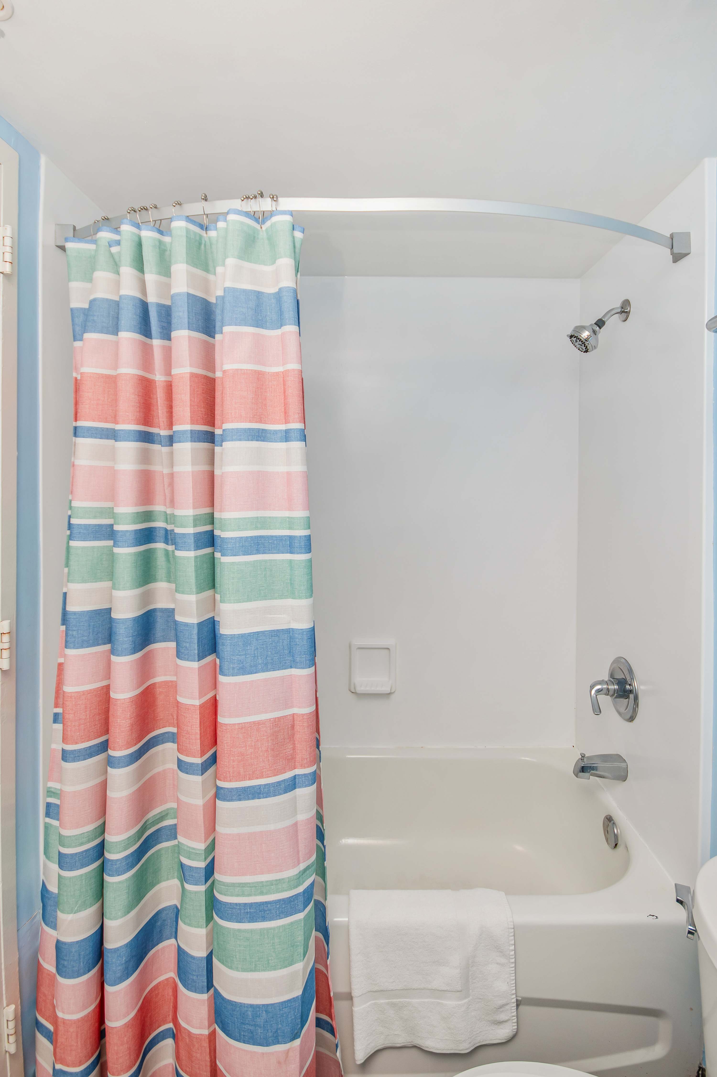 Comfort meets style in this clean, functional bathroom retreat.
