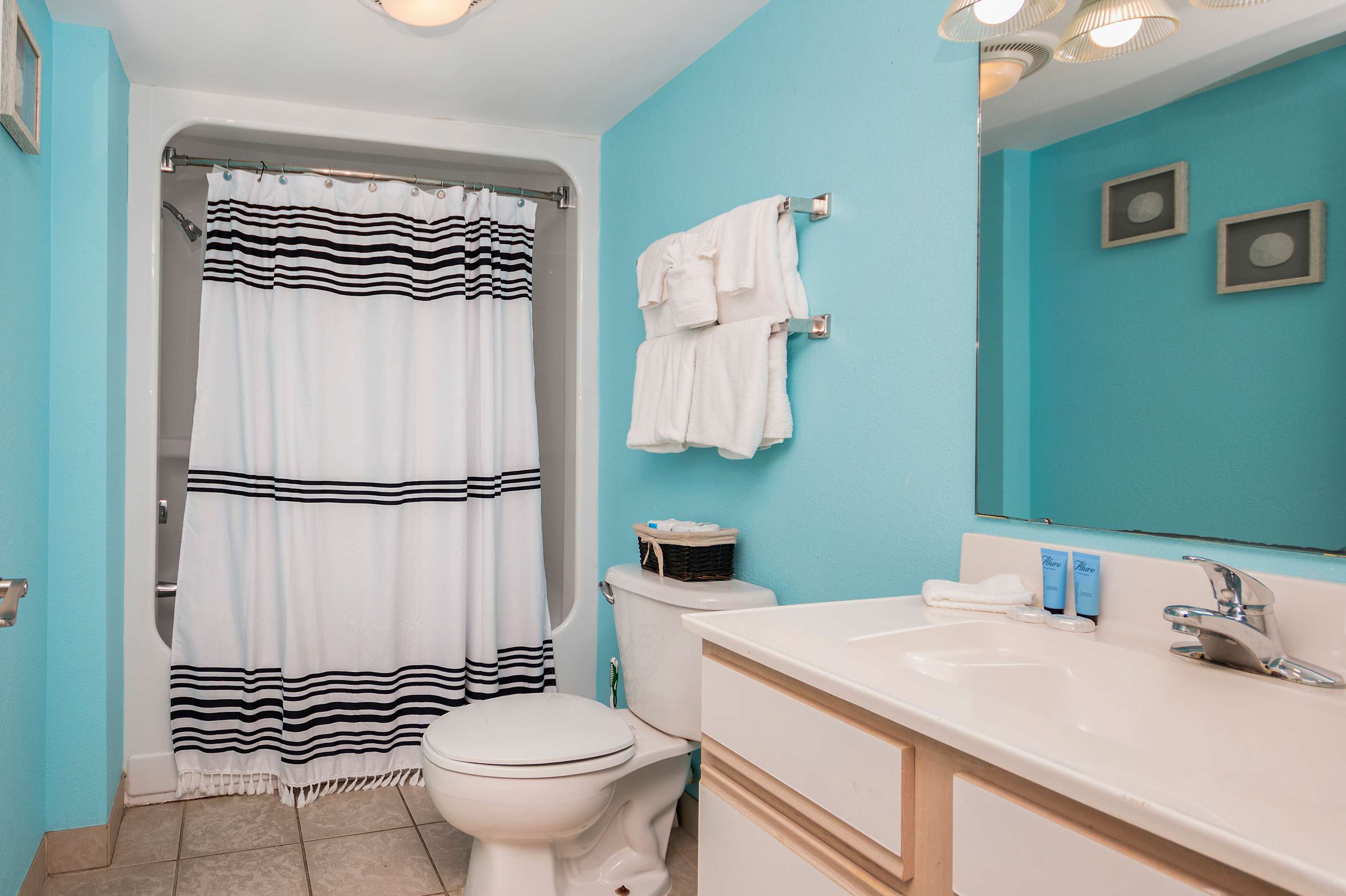 Start your beach day with a bright vanity and fluffy, hotel-style towels.
