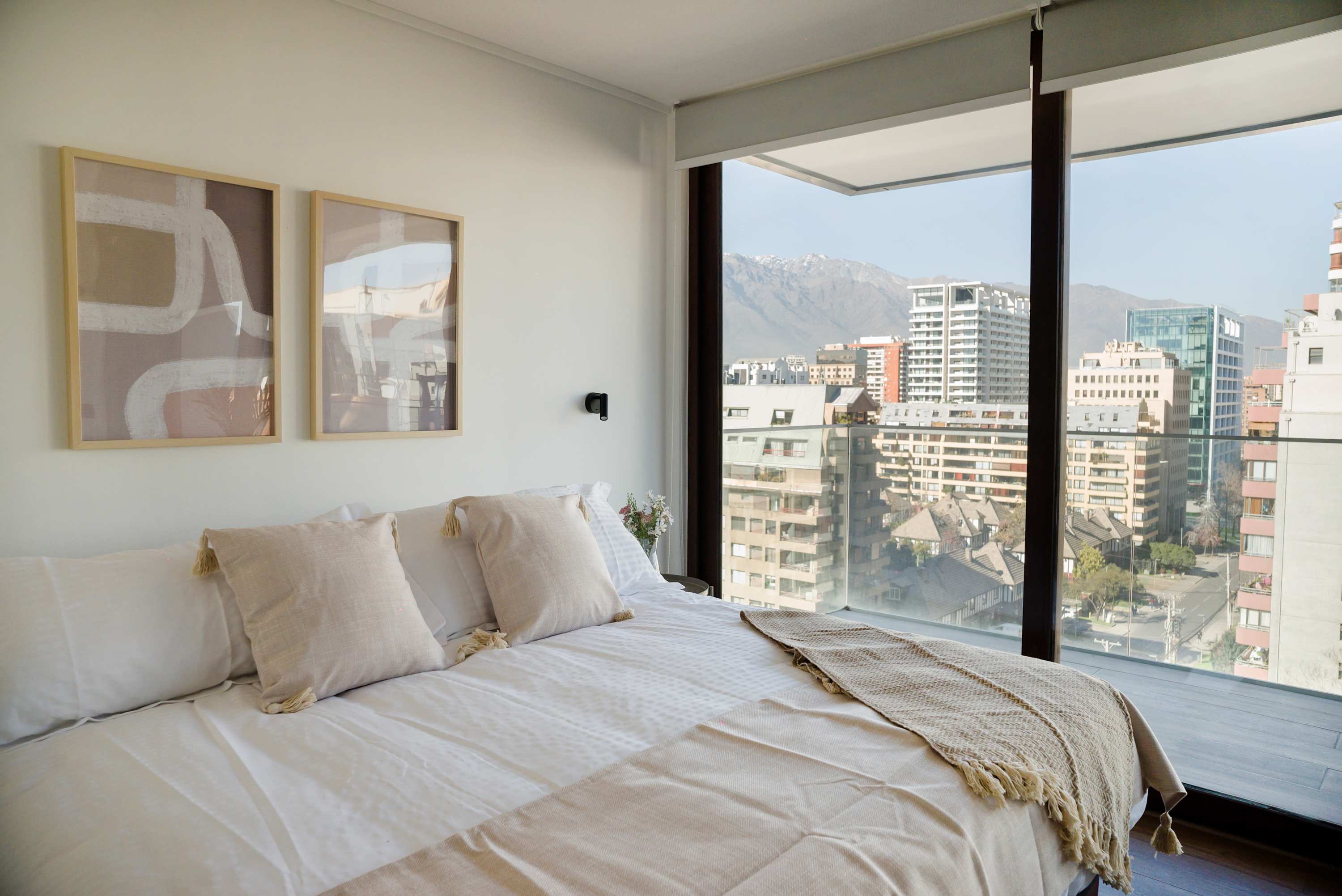 Wake up to breathtaking city and mountain views in this stylish and serene bedroom retreat.