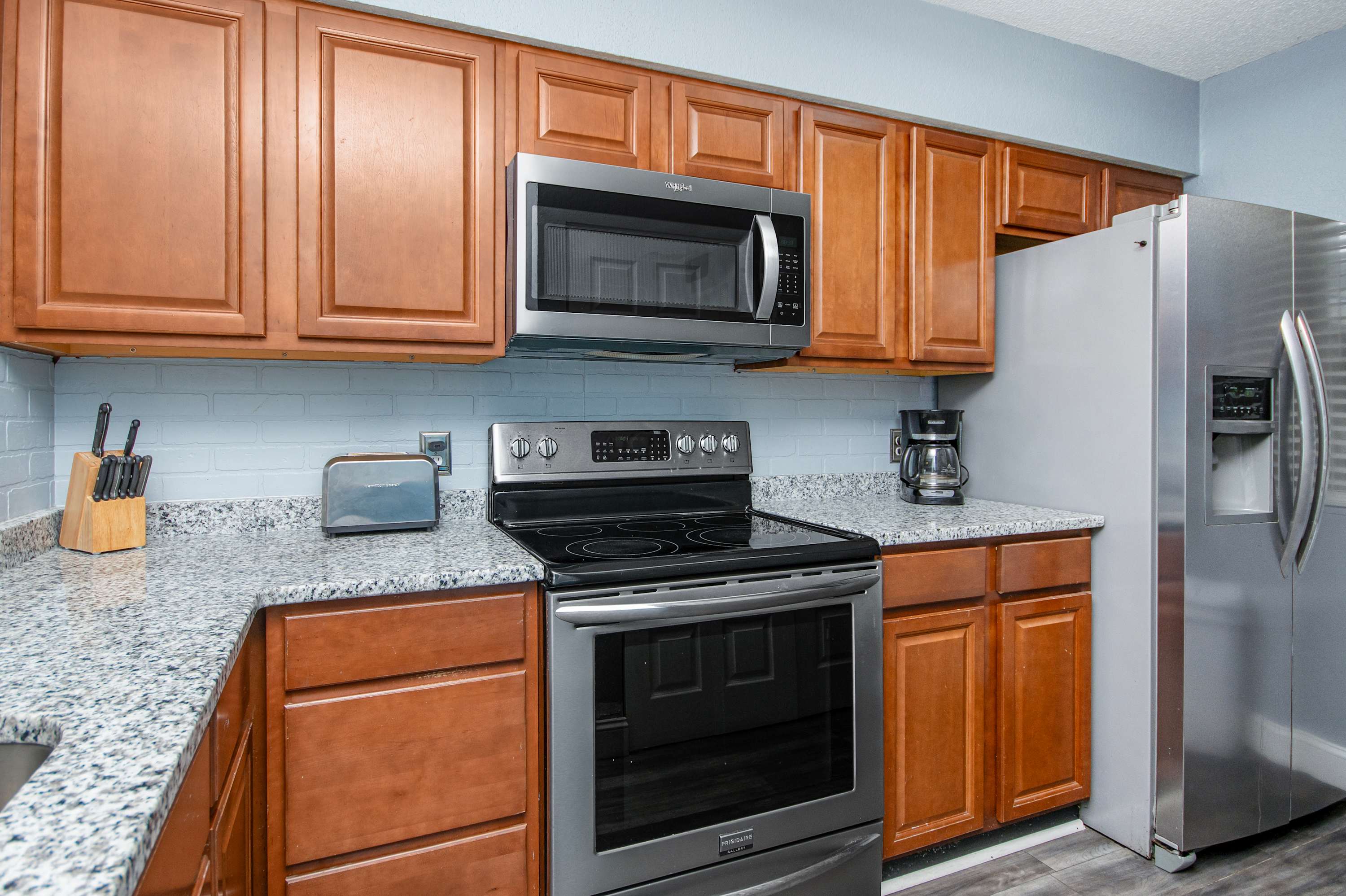 Coastal touches and practical space make this a dream for beachside cooking.
