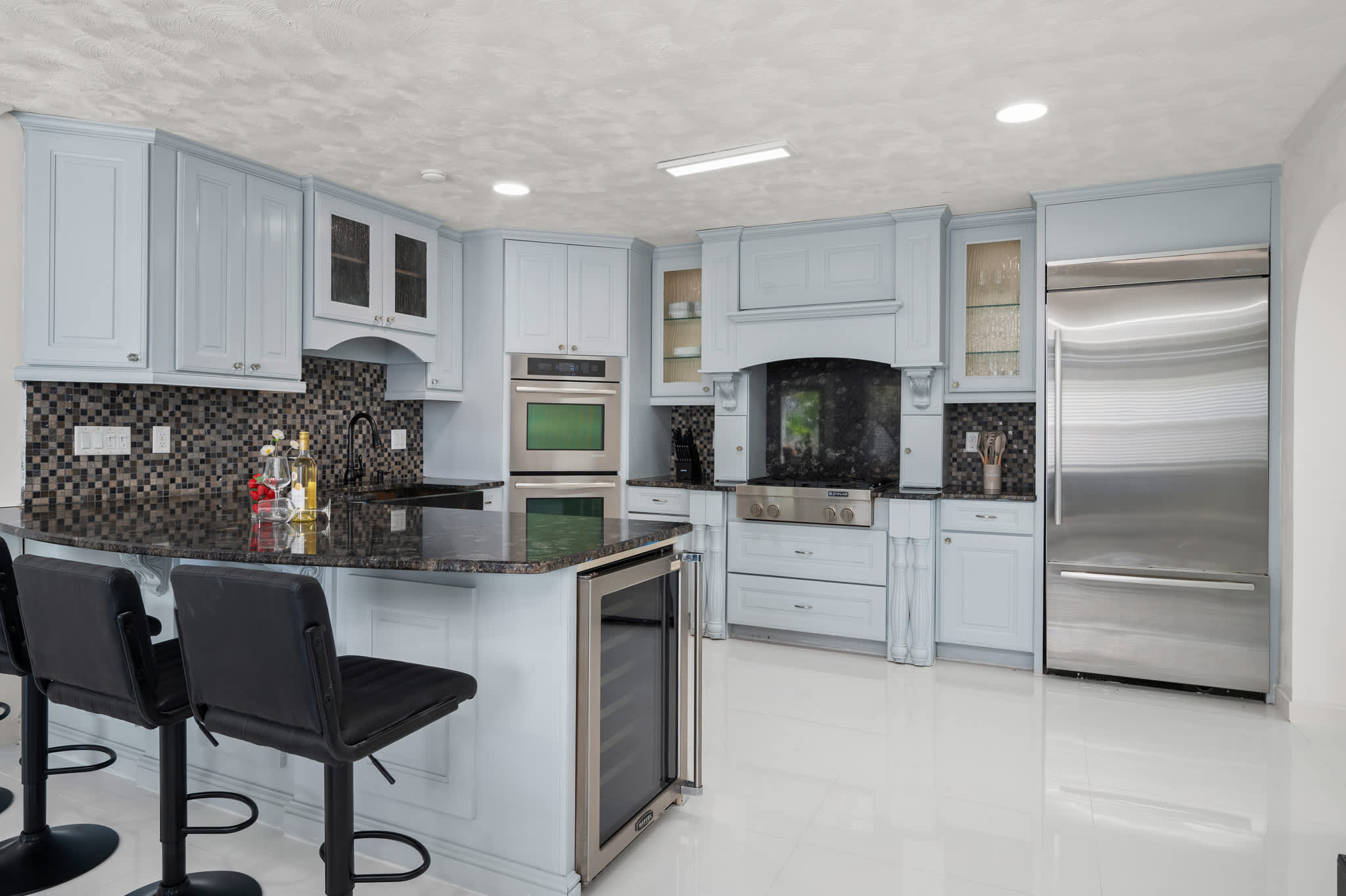 Whip up delicious meals in our stunning, fully equipped kitchen featuring sleek granite countertops and stainless steel appliances.
