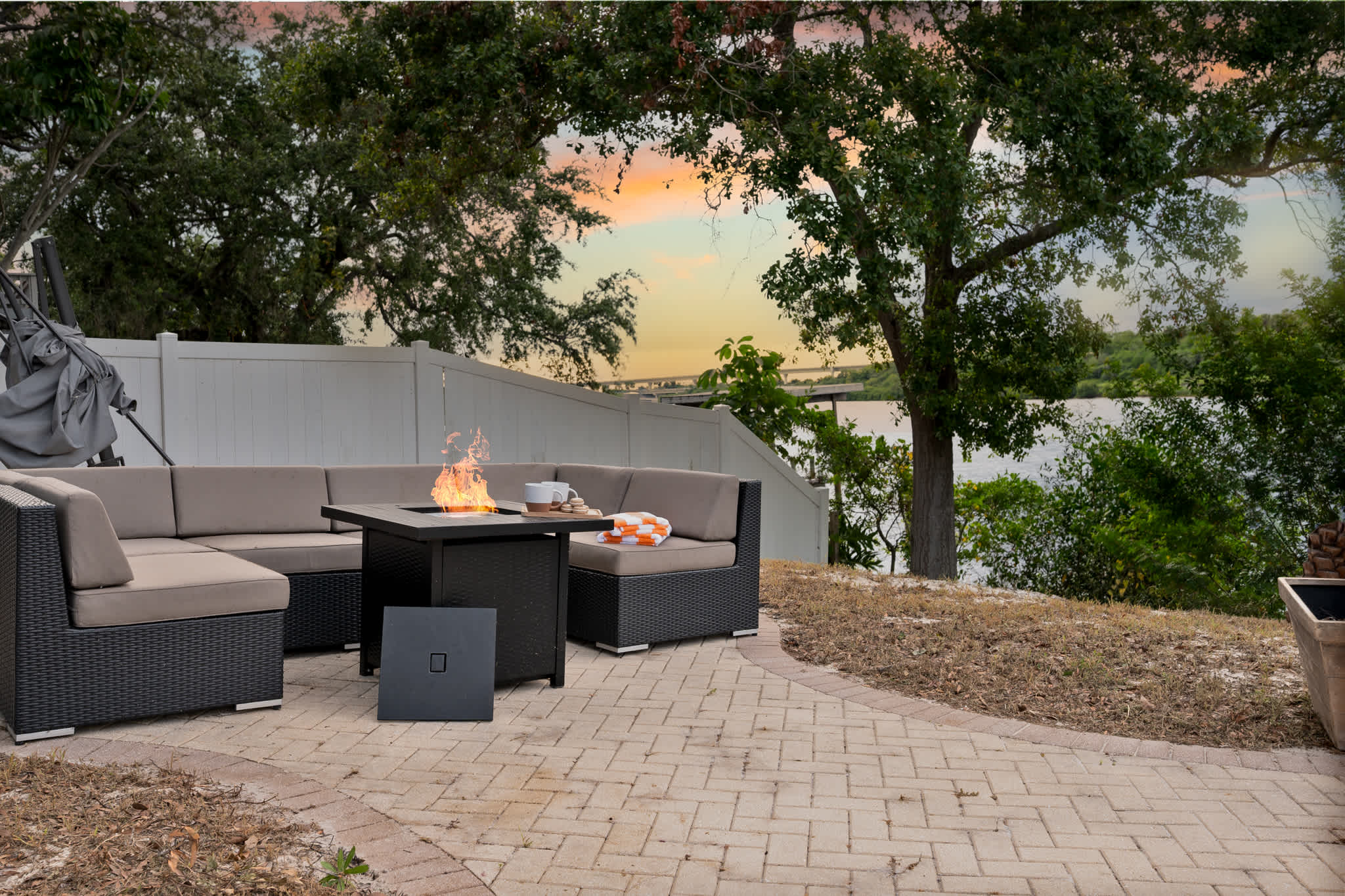 Outdoor living at its finest: Fire pit, comfy seating, and beautiful views!