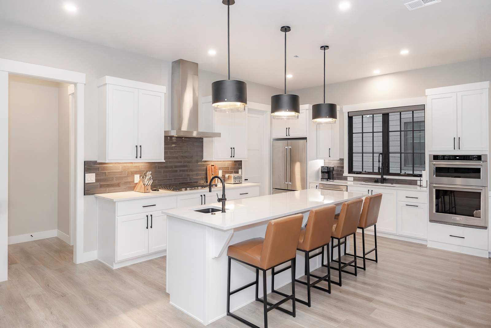 - This gourmet kitchen is a chef's dream, offering a perfect space for preparing delicious meals and gathering with loved ones. With high-end appliances and a spacious island, it's designed for memorable culinary experiences.