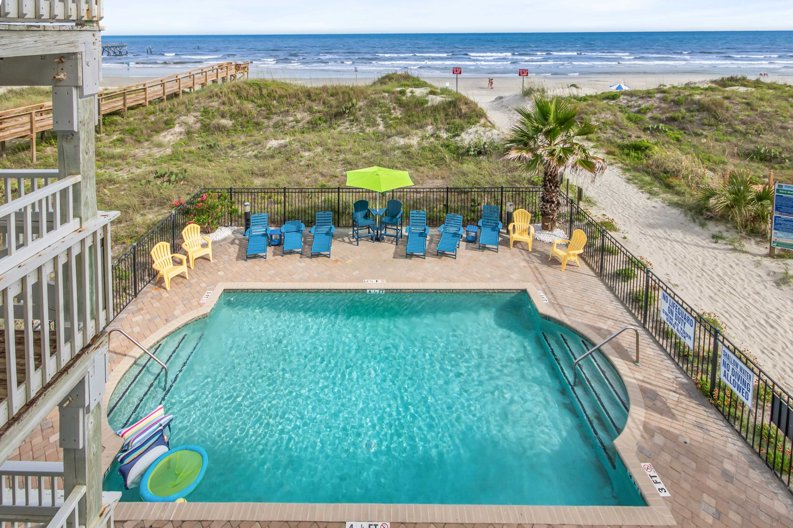 Dive into vacation mode in the sparkling outdoor pool—just steps from your door.
