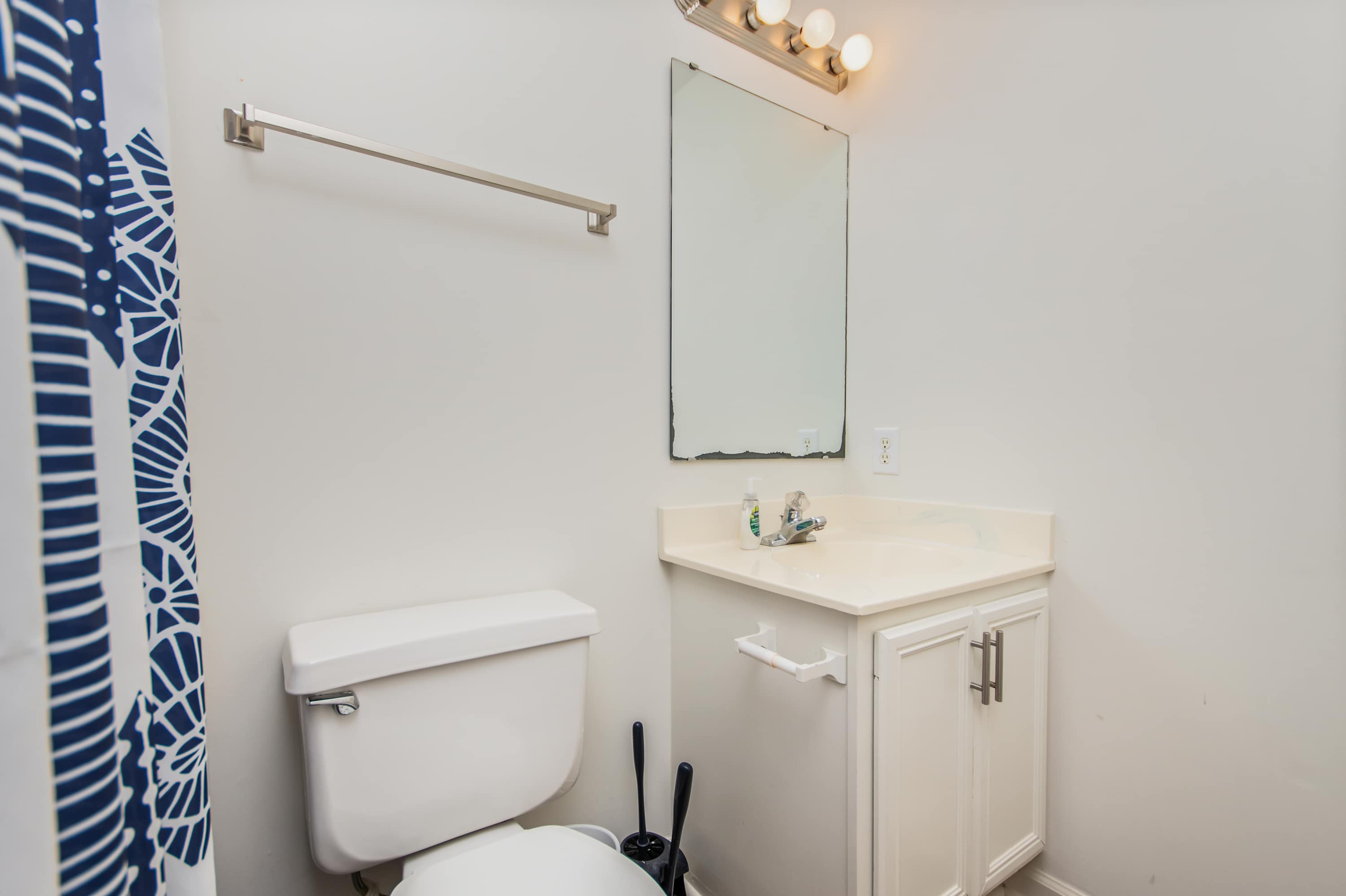 Recharge in this bright, beach-inspired bathroom with all the comforts of home.
