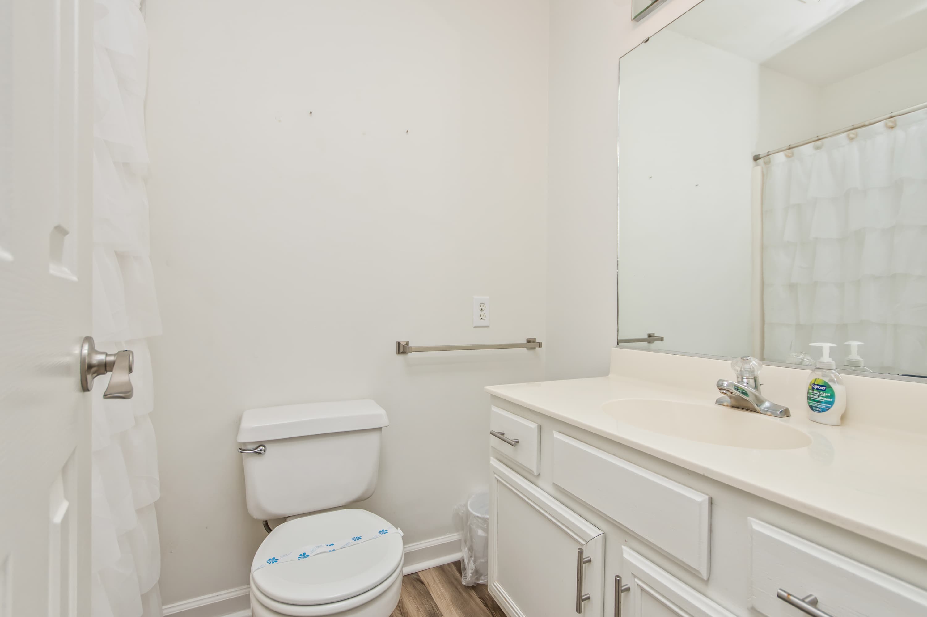 Comfort meets style in this clean, functional bathroom retreat.
