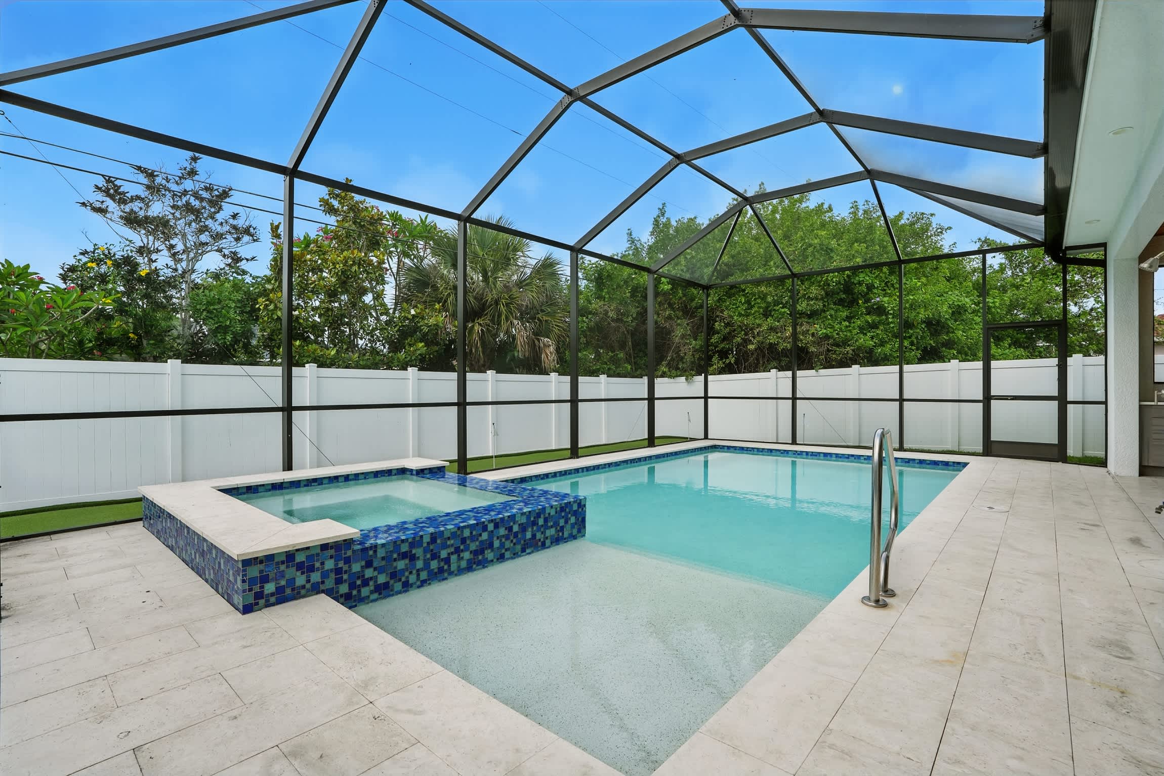 Dive into relaxation in our rectangular-shaped pool and indulge in the ultimate rejuvenation as you soak in the spacious above-ground spa—a true oasis of serenity