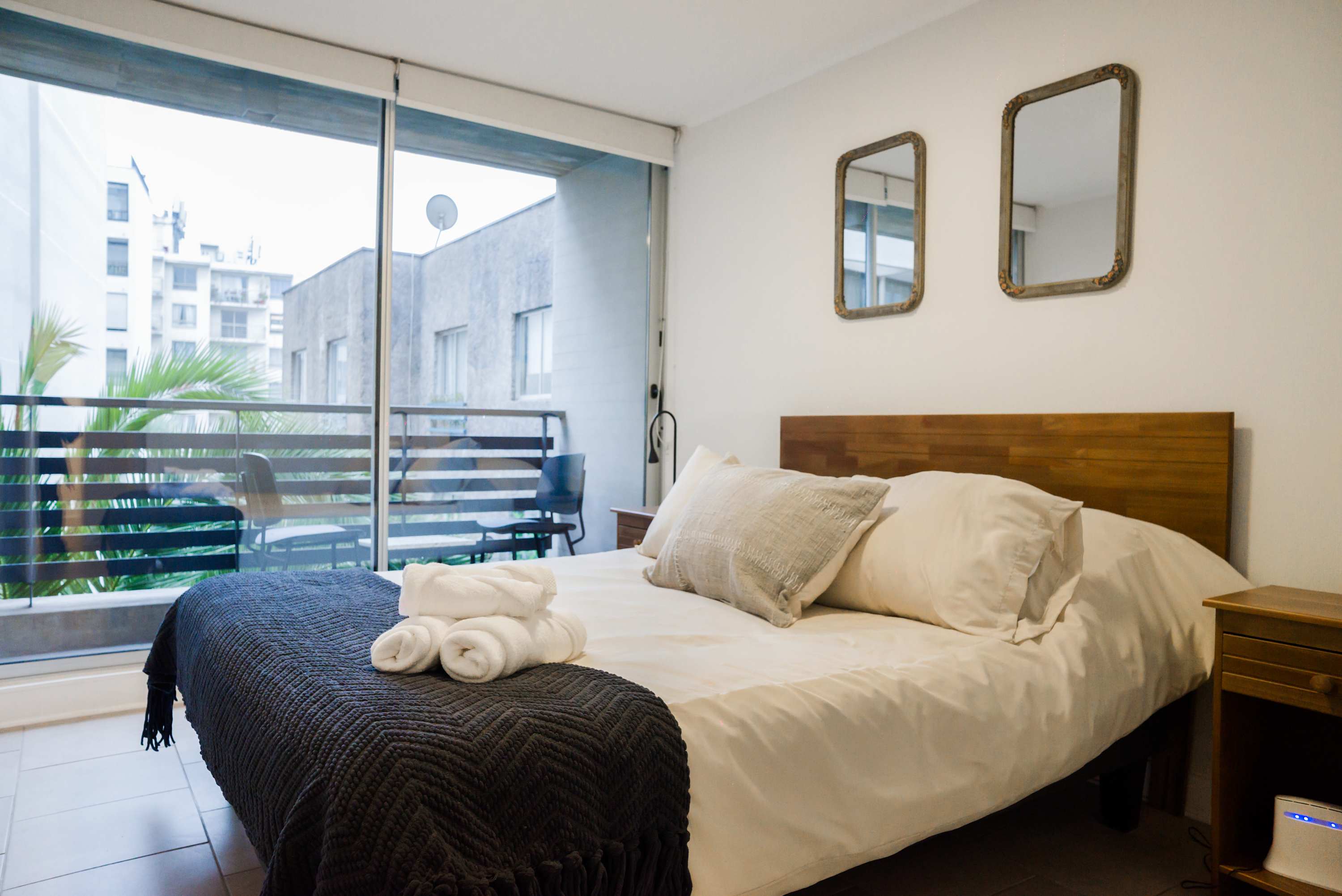 Relax in this cozy bedroom with a private balcony, perfect for enjoying morning coffee or evening sunsets.