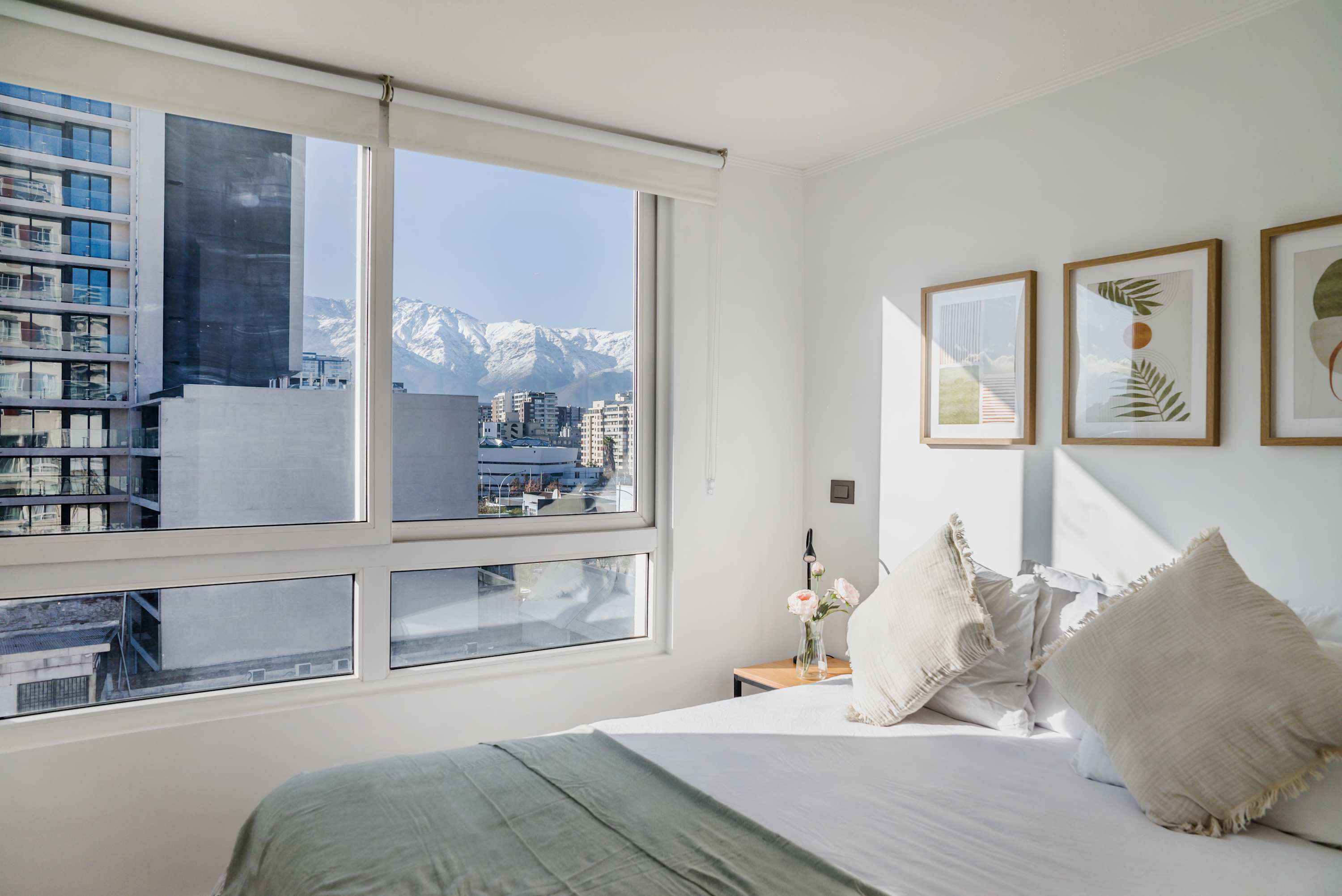 Wake up to breathtaking mountain views in this serene bedroom retreat, complete with stylish decor and natural light.
