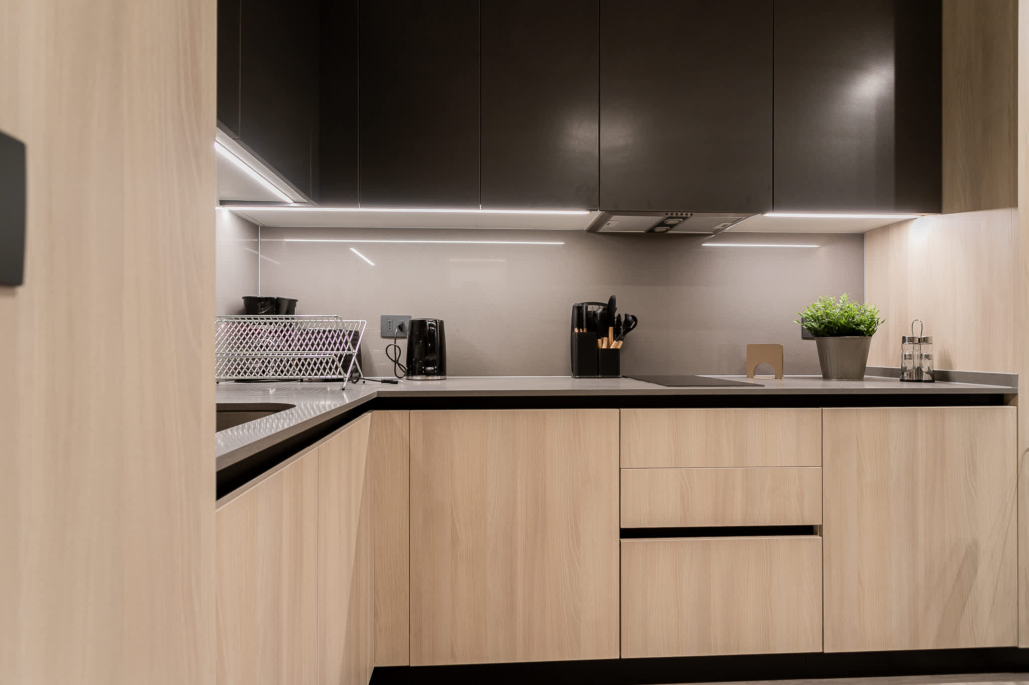 Sleek and modern kitchen with all essentials, perfect for cooking your favorite meals in style.