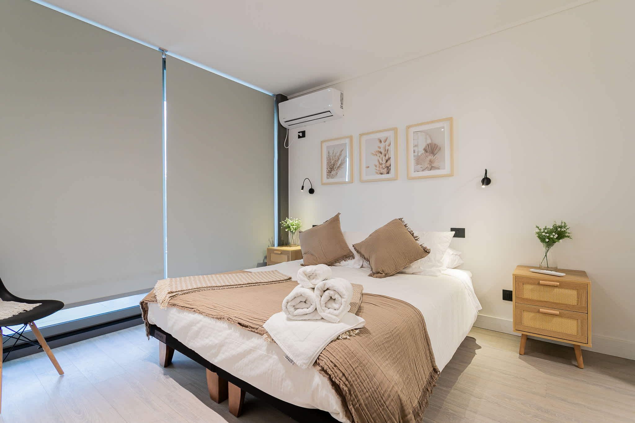 Relax in this serene bedroom with modern decor and cozy ambiance, perfect for unwinding after a day of exploring.