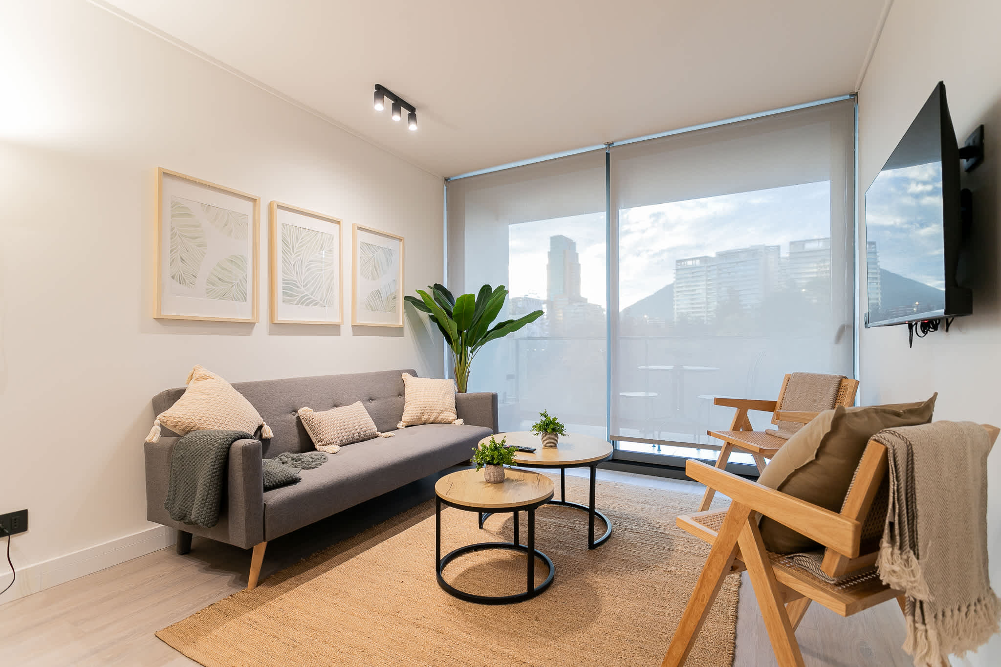 Relax in this chic living room with stunning city views, cozy seating, and stylish decor.