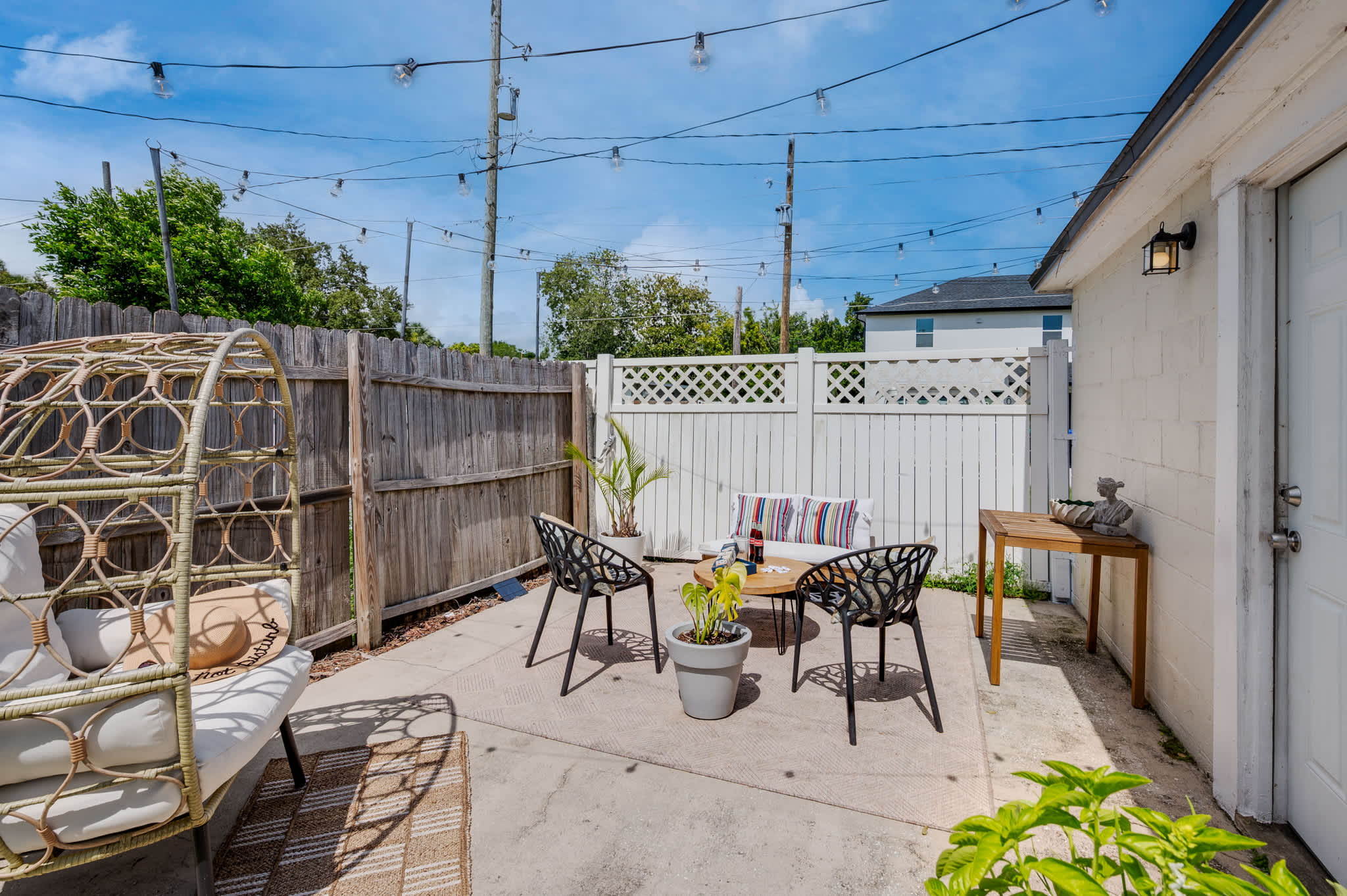 Discover your peaceful outdoor escape! This charming patio, complete with cozy seating and ambient lighting, is ideal for unwinding.