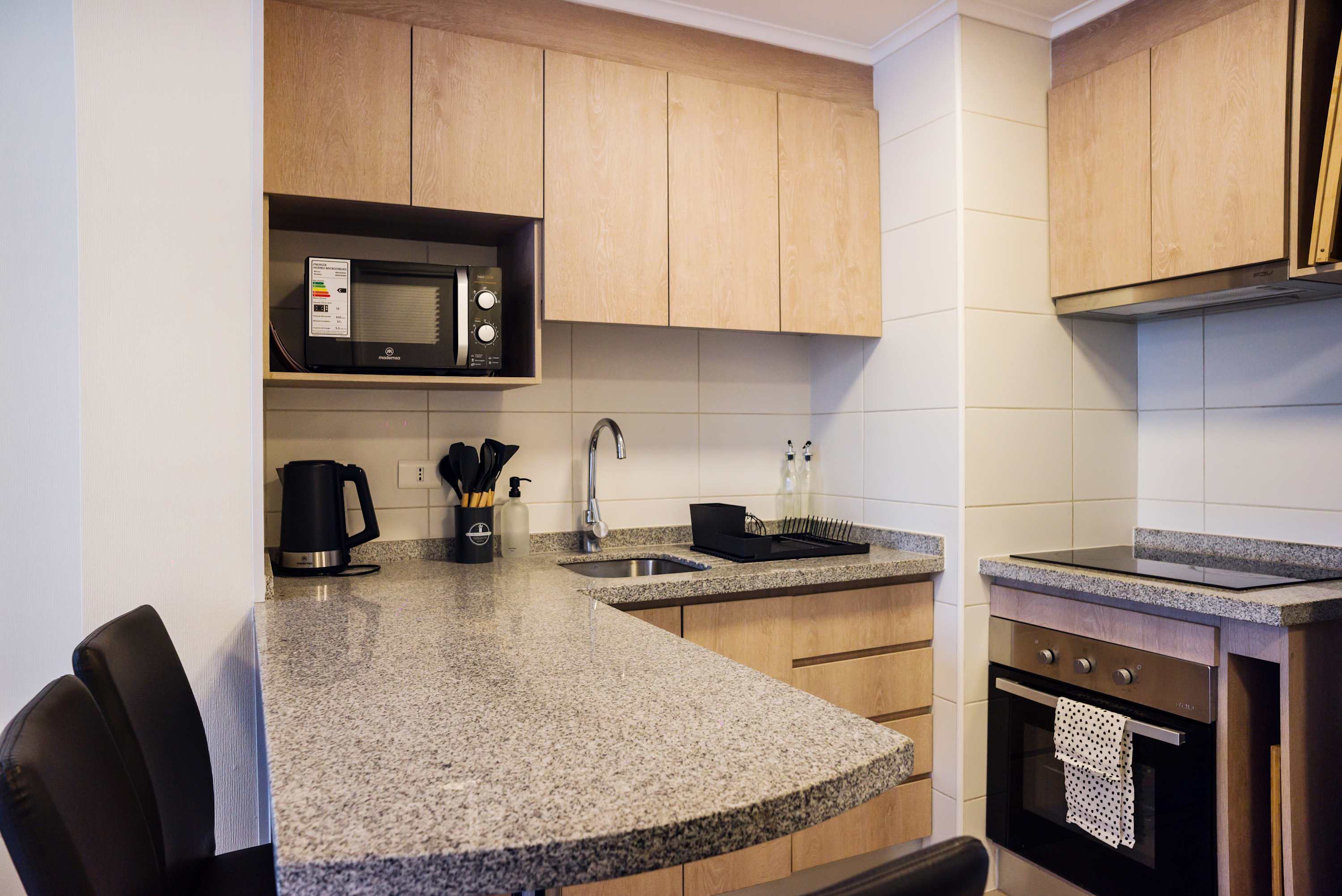 Modern and efficient kitchen with all essentials for a cozy stay in the heart of Chile.