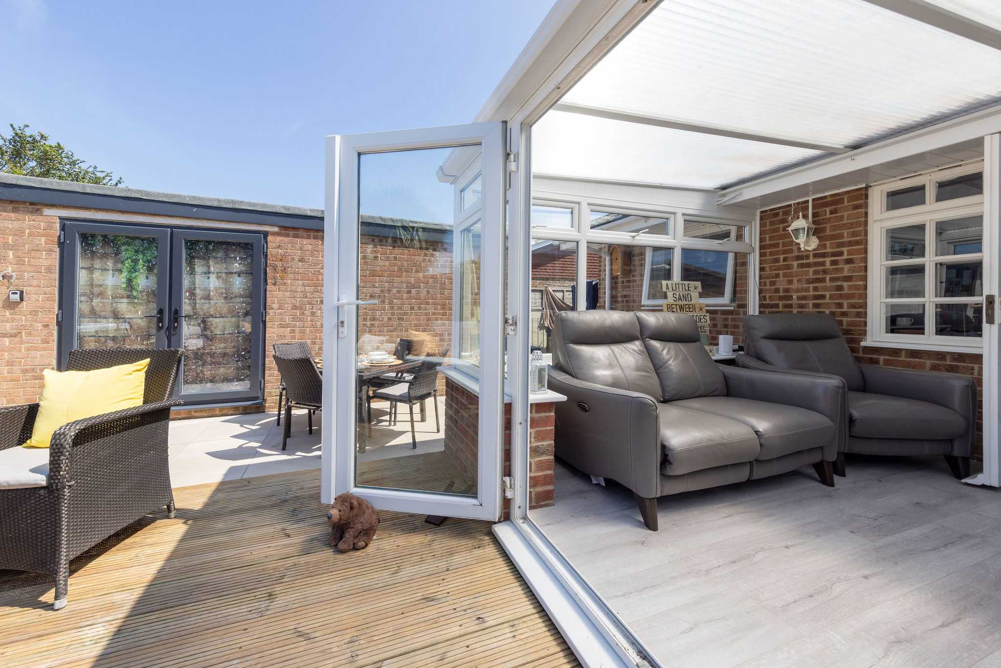 Conservatory opens onto the sunny deck