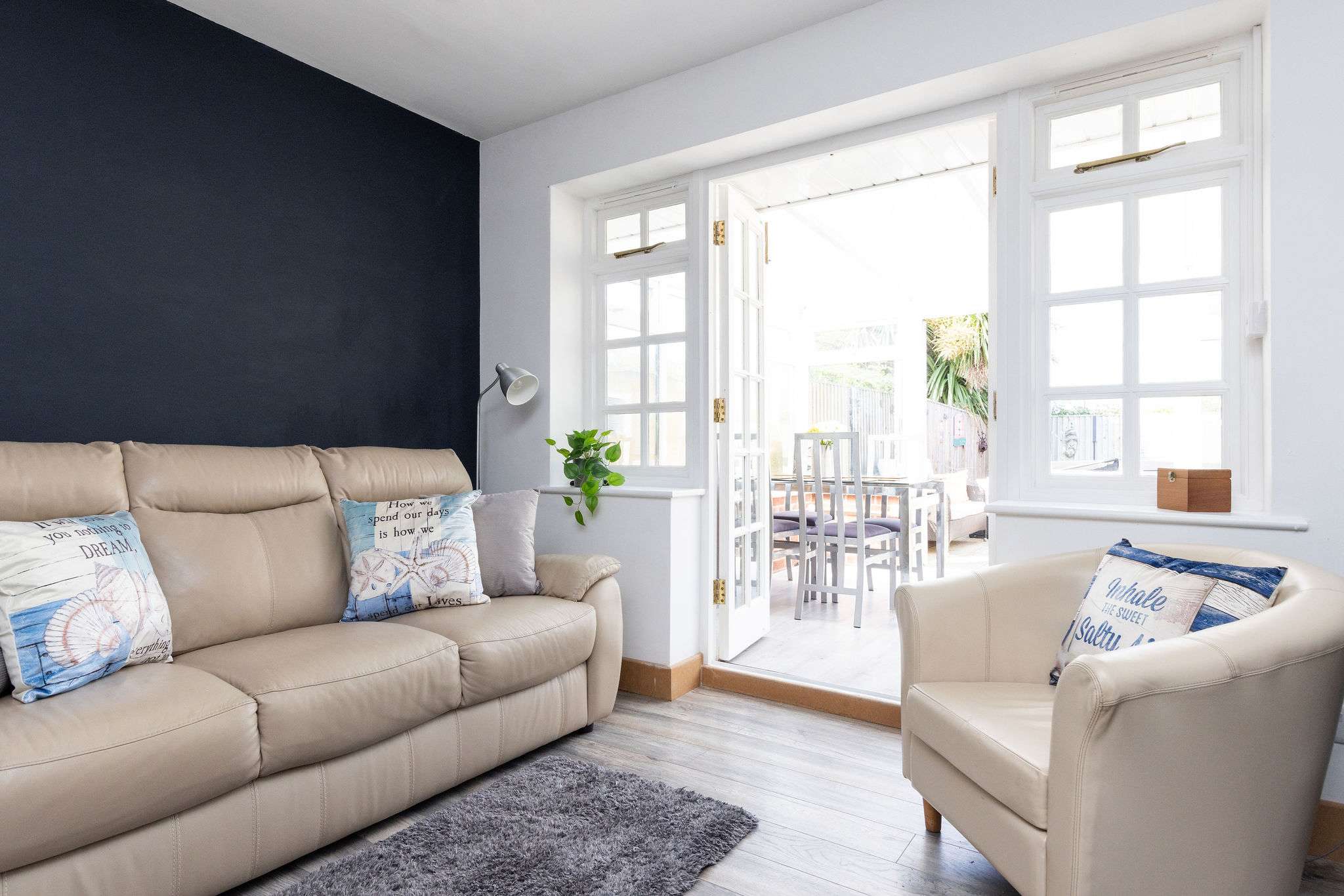 Comfy lounge with access to the conservatory and garden