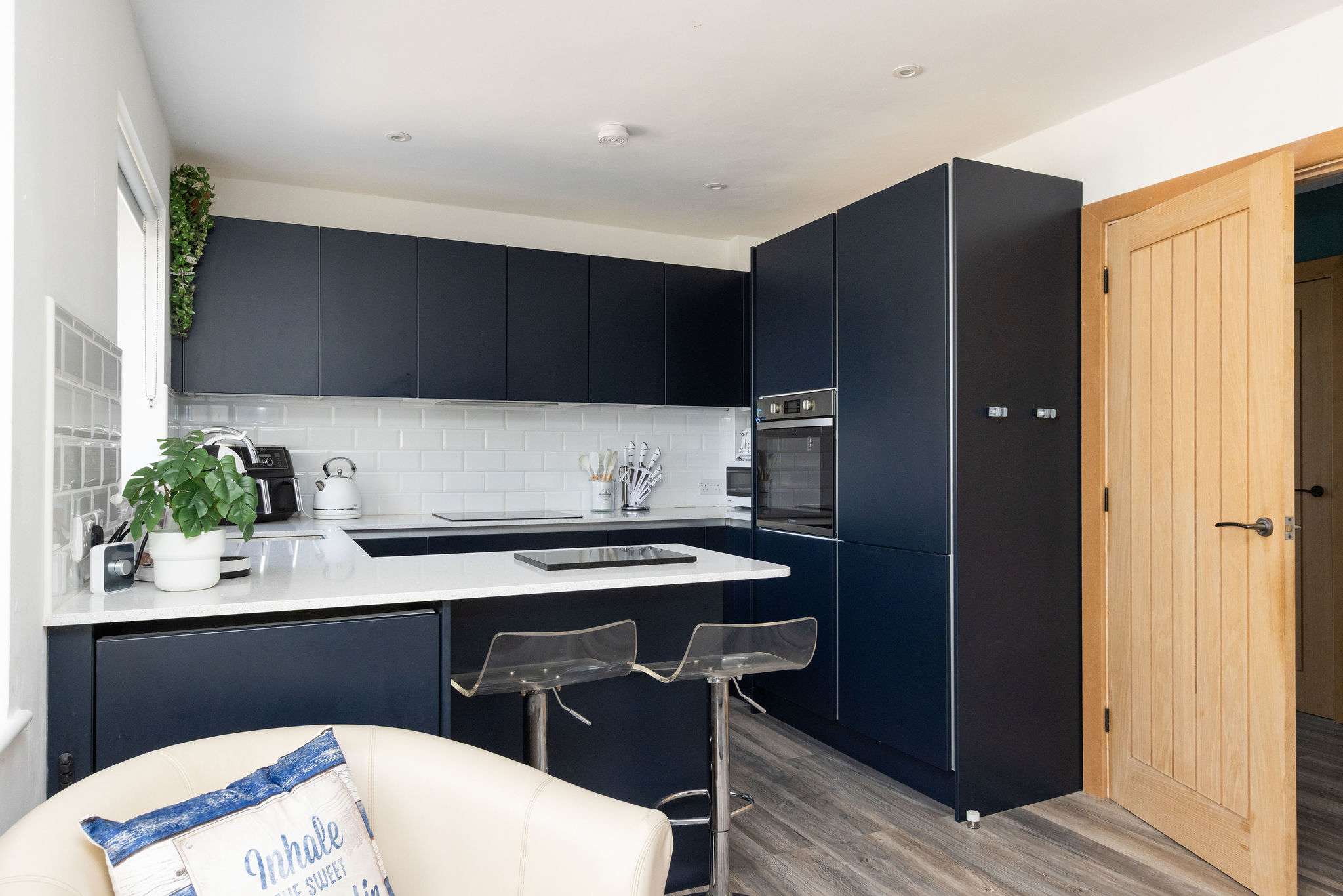 Sleek, modern kitchen with island seating