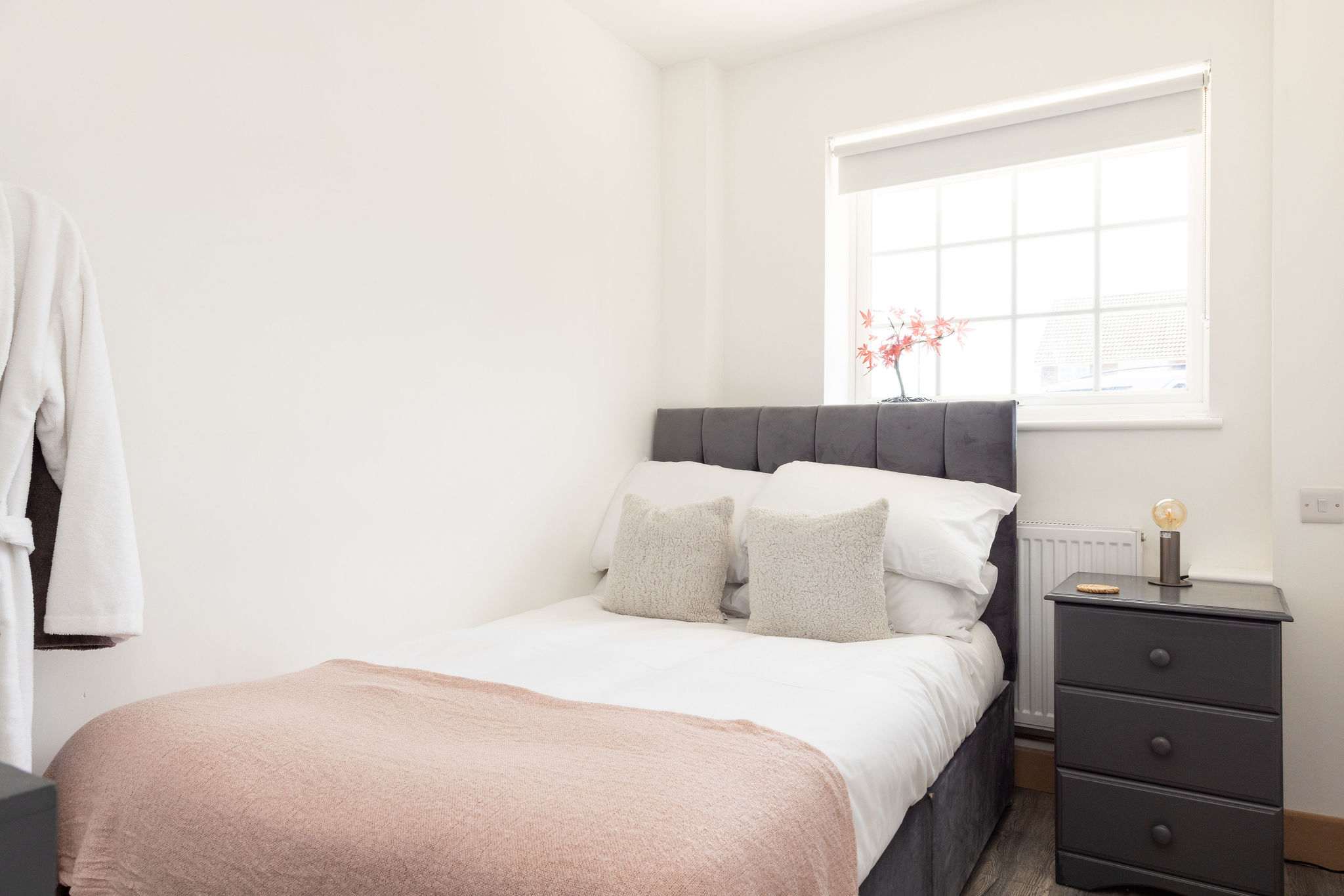 Cosy double bedroom with soft lighting