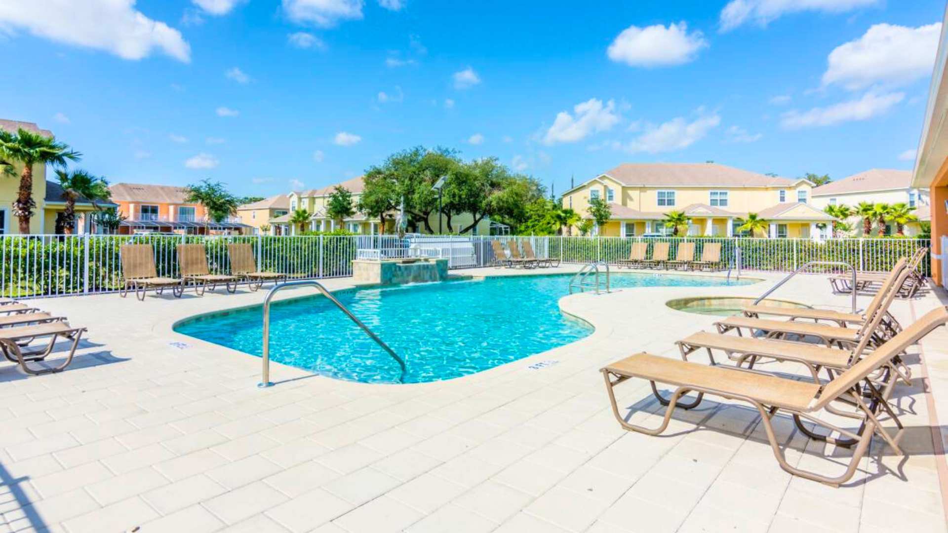 Resort Outdoor Community Pool with Sun Loungers