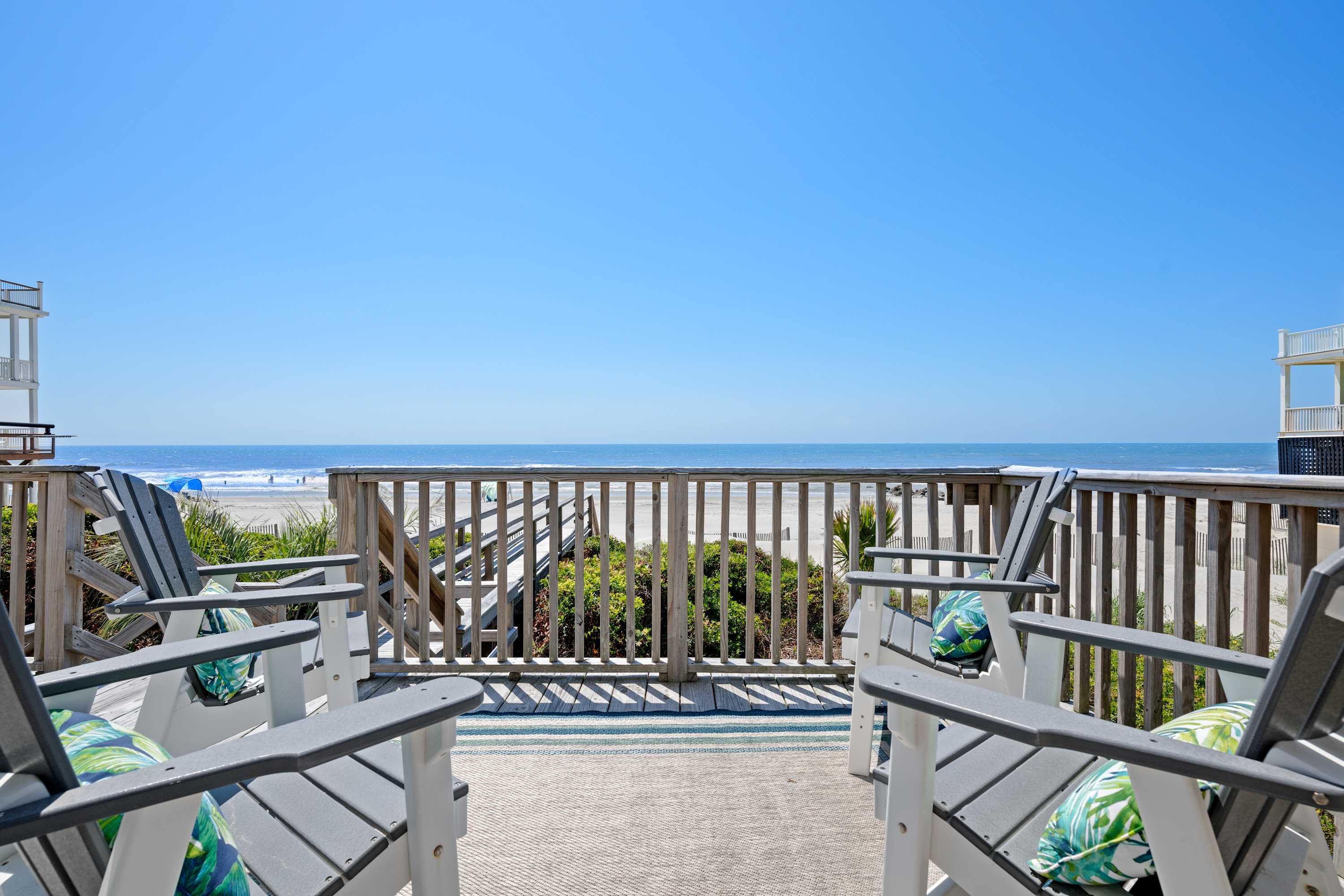 Plenty of outdoor seating on the deck with beach views! 