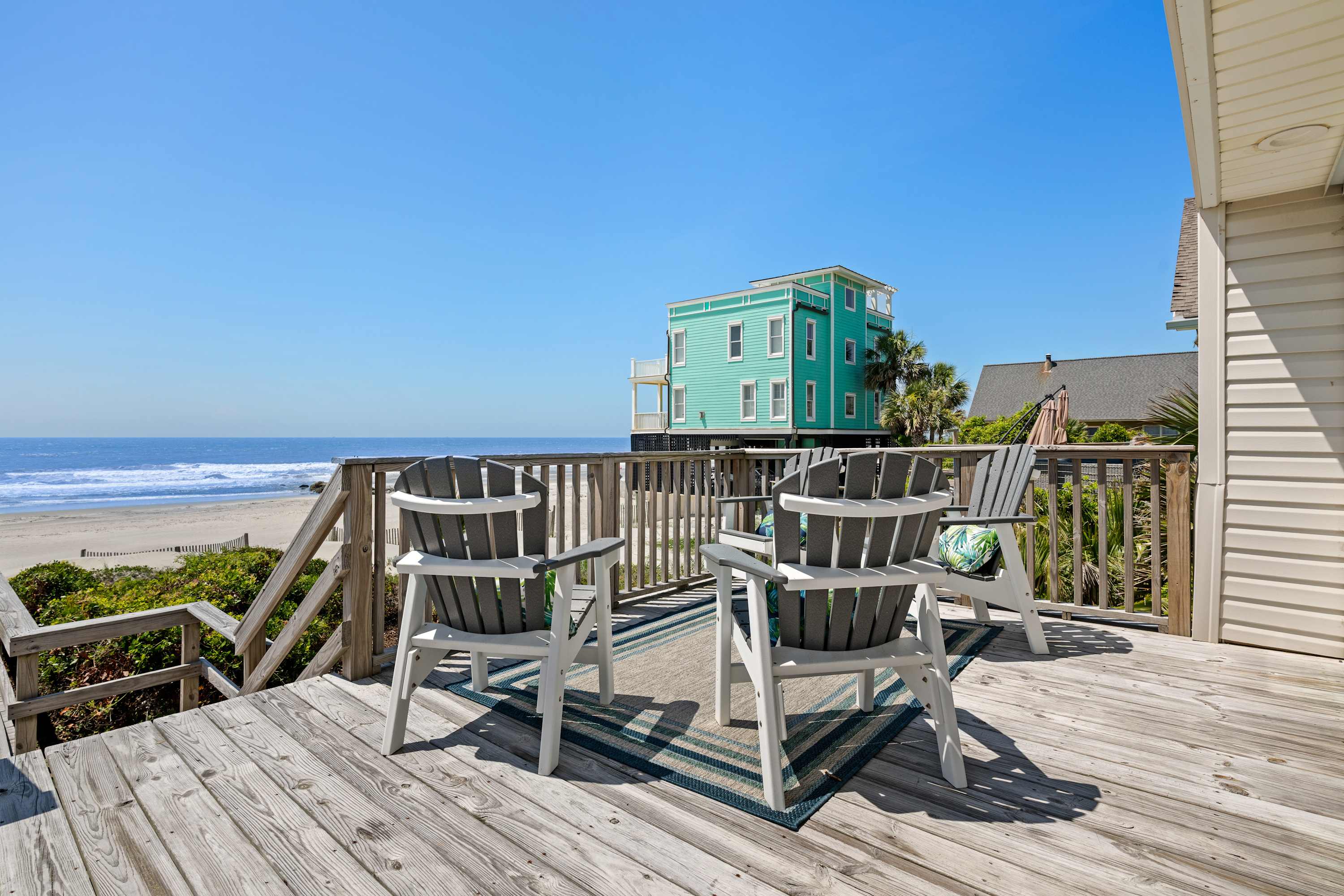 Plenty of outdoor seating on the deck with beach views! 