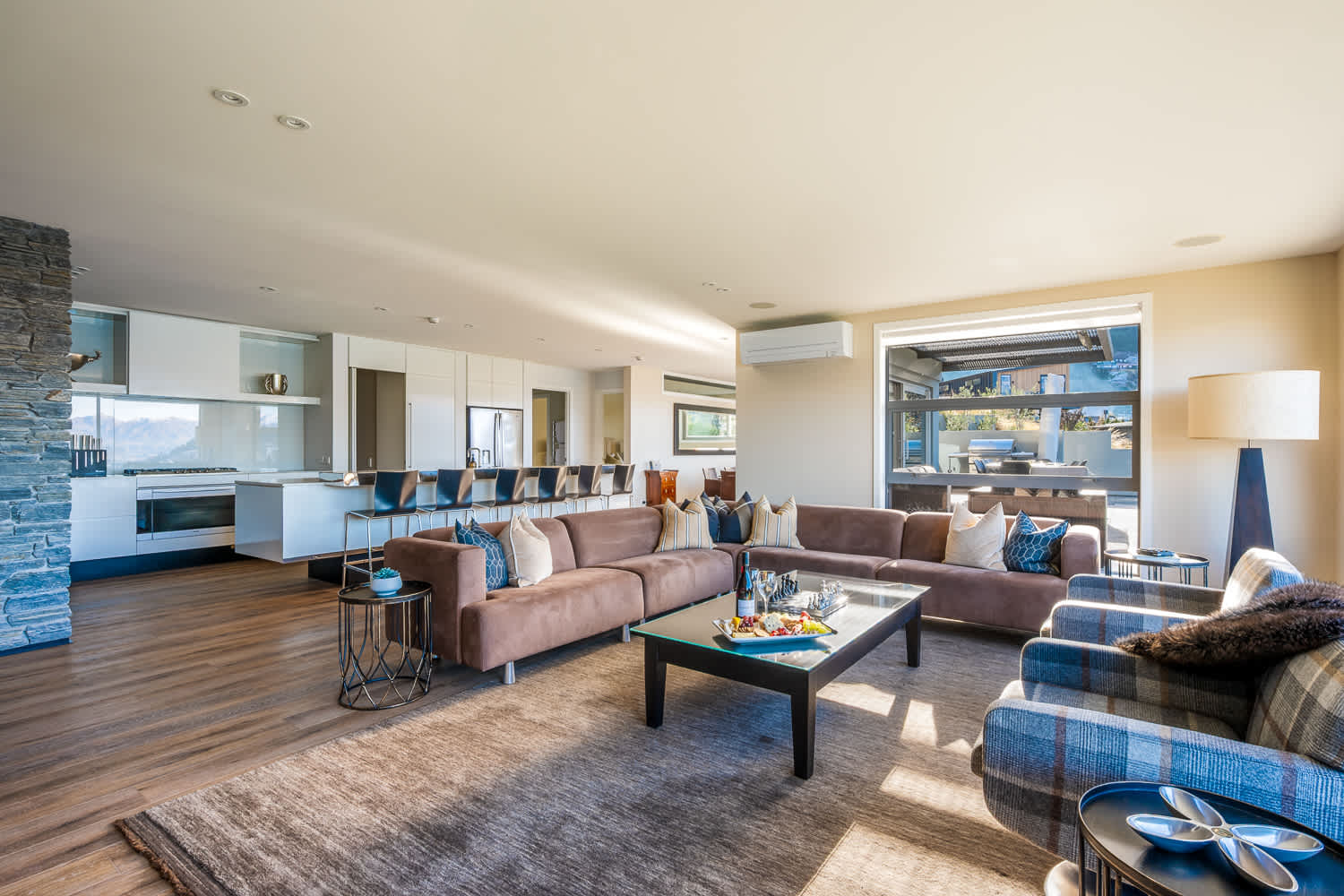 Open, airy, and inviting, the living area connects seamlessly to the balcony for indoor-outdoor living. Enjoy spectacular Queenstown sunsets from every angle.