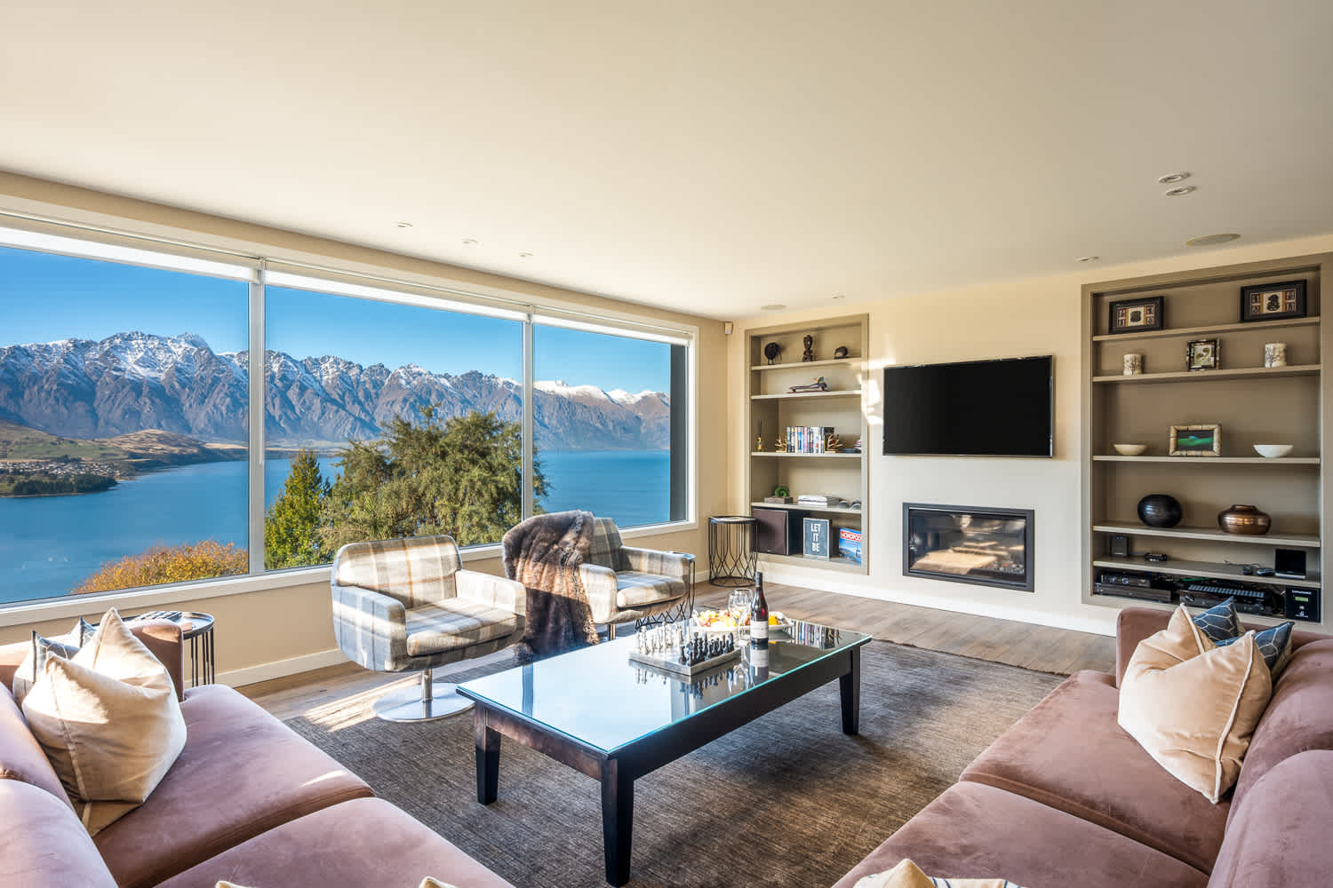 Stylish furnishings and natural light create a welcoming atmosphere in the living area. It’s an ideal spot to enjoy quality time or simply take in the breathtaking scenery.