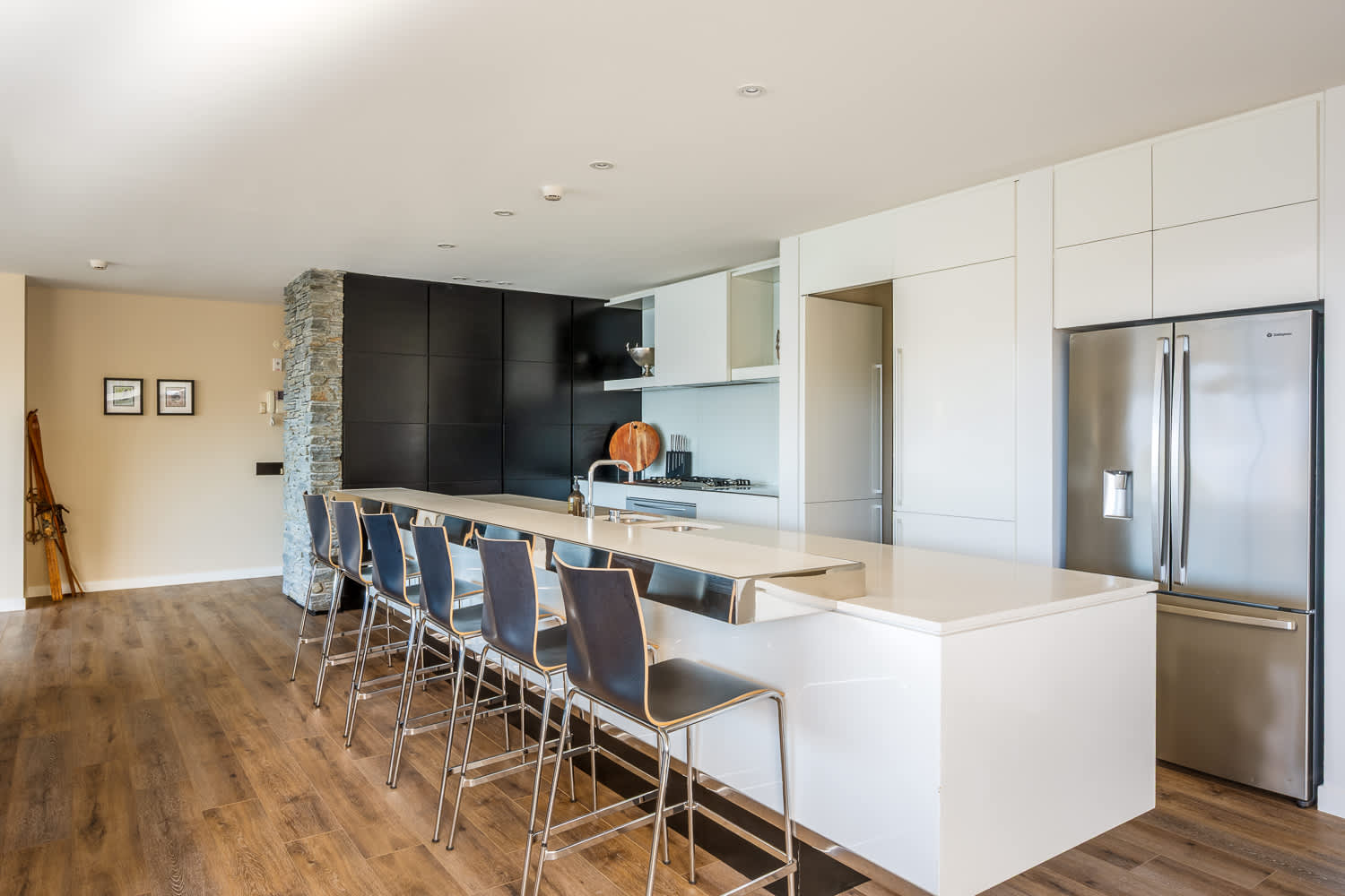 The modern kitchen features top-of-the-line appliances and ample counter space for all your cooking needs. Whether preparing a quick breakfast or a gourmet dinner, you’ll find everything at your fingertips.