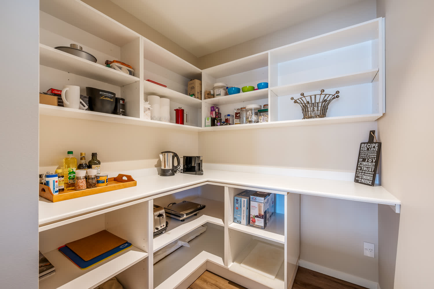 The spacious pantry offers ample storage for all your groceries and cooking essentials. Keep everything organized and easily accessible during your Queenstown stay.