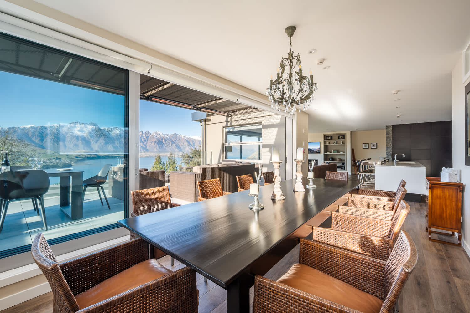 Enjoy alfresco dining options just steps away on the balcony, or gather indoors at the spacious dining table. This area is designed for comfort and connection amid breathtaking scenery.
