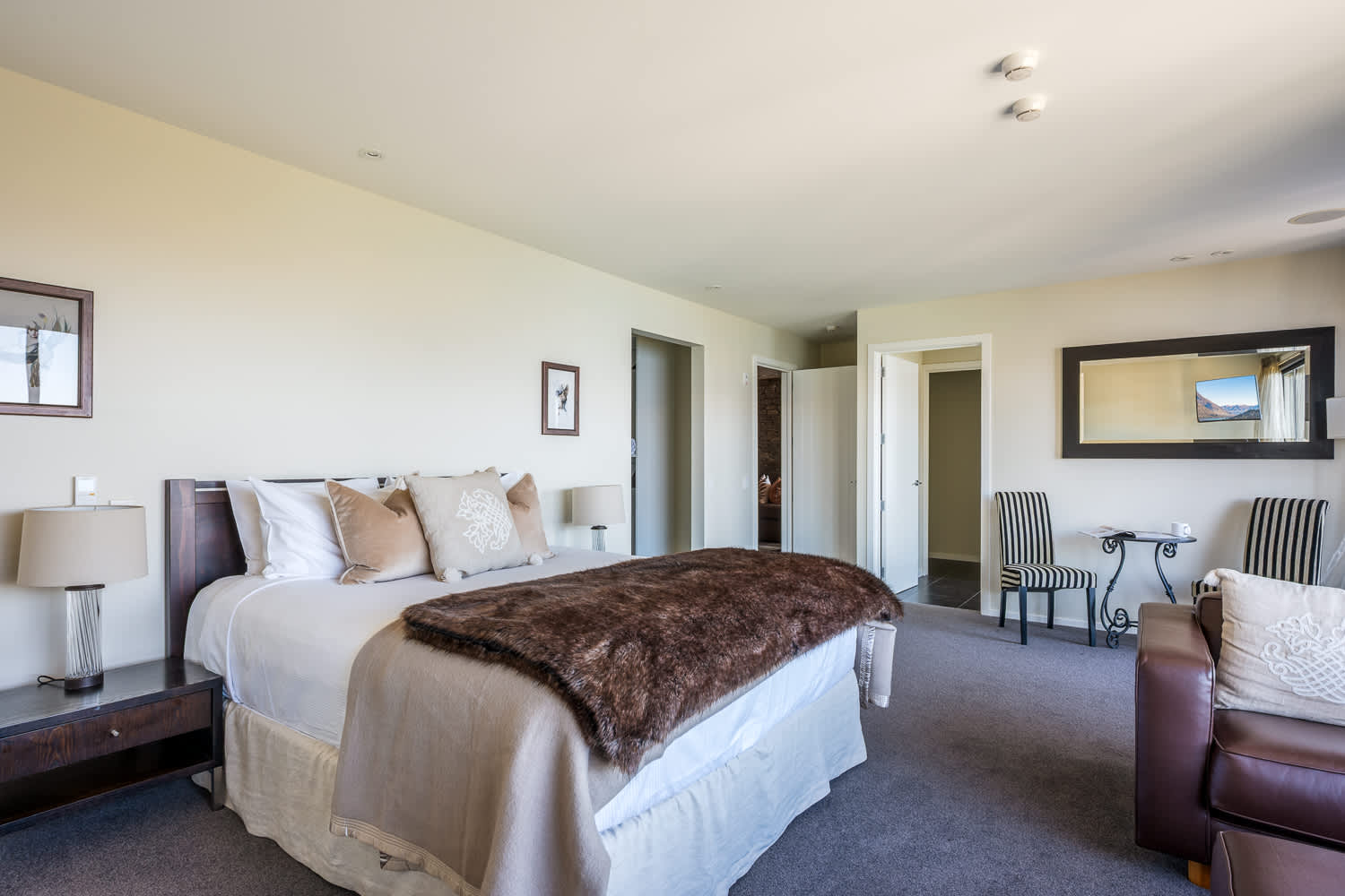 Wake up to breathtaking Queenstown scenery in the serene master bedroom retreat. The ensuite bathroom offers a sleek, contemporary design with all the comforts you need.