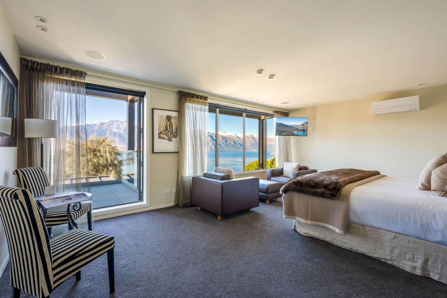 Relax in the elegant master suite designed for comfort and style, with plush linens and ambient lighting. The ensuite includes a walk-in shower and premium amenities for a hotel-quality experience.