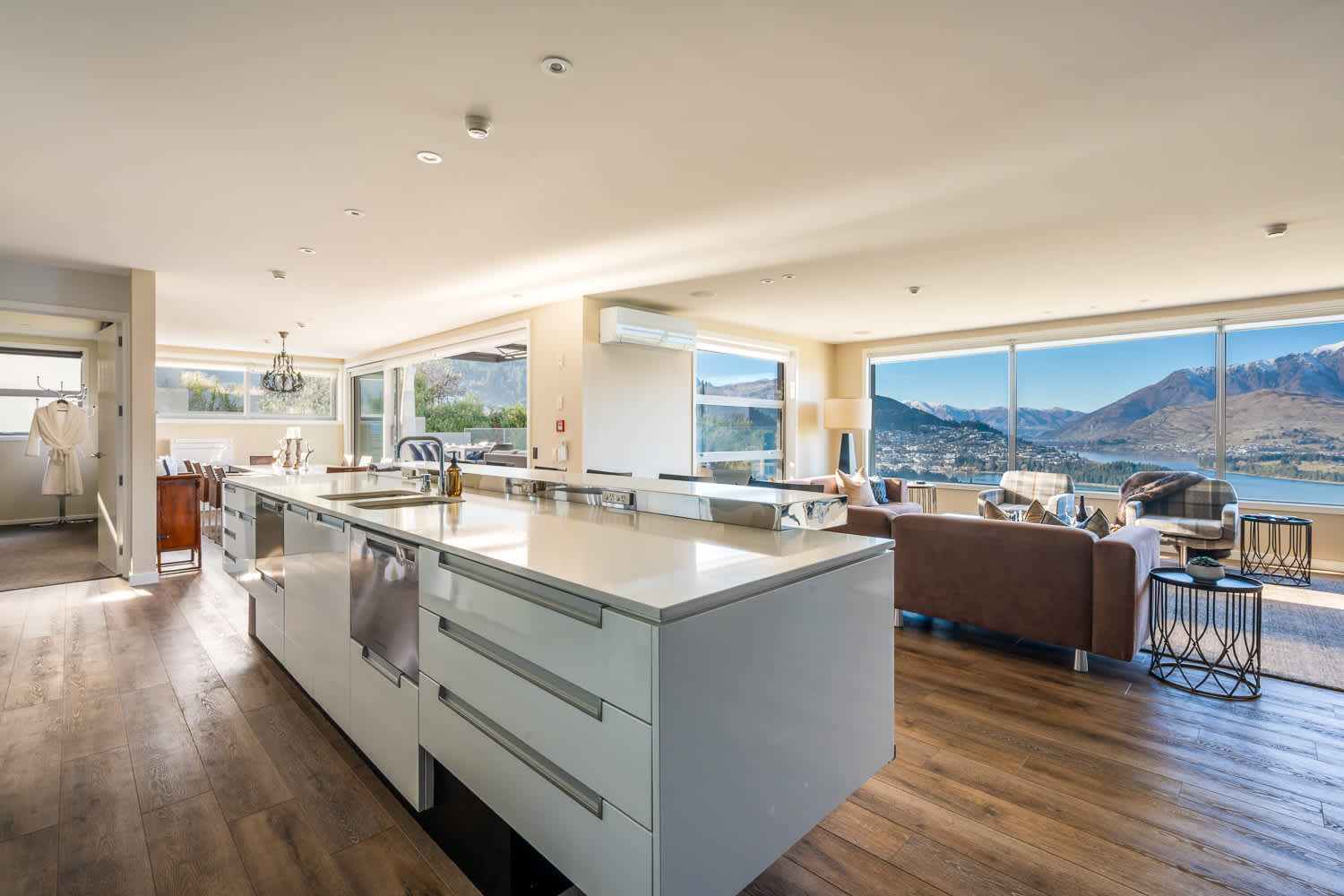 Enjoy the convenience of a well-stocked pantry alongside sleek cabinetry and contemporary finishes. This kitchen is perfect for creating memorable meals during your Queenstown getaway.