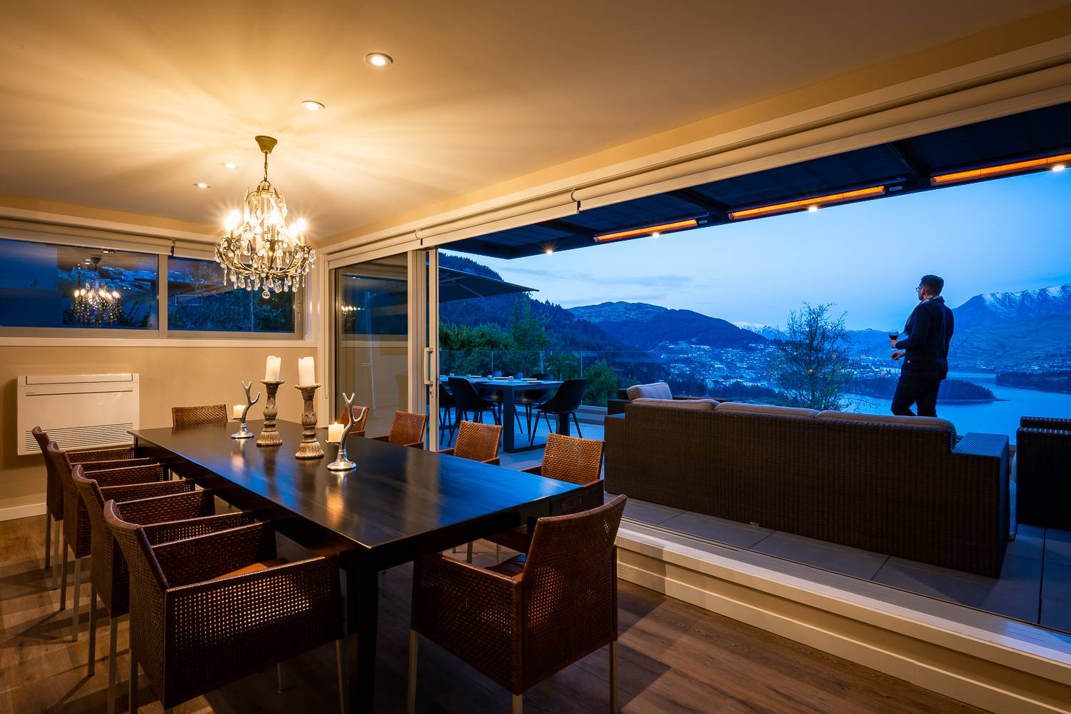The elegant dining area comfortably seats six, perfect for memorable meals with family or friends. Large windows provide stunning views of Lake Wakatipu and the surrounding mountains.