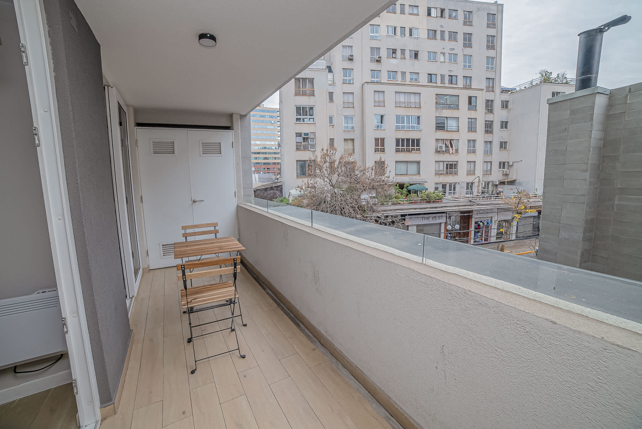 Enjoy morning coffee on your private balcony with city views, perfect for relaxing in the heart of Santiago.