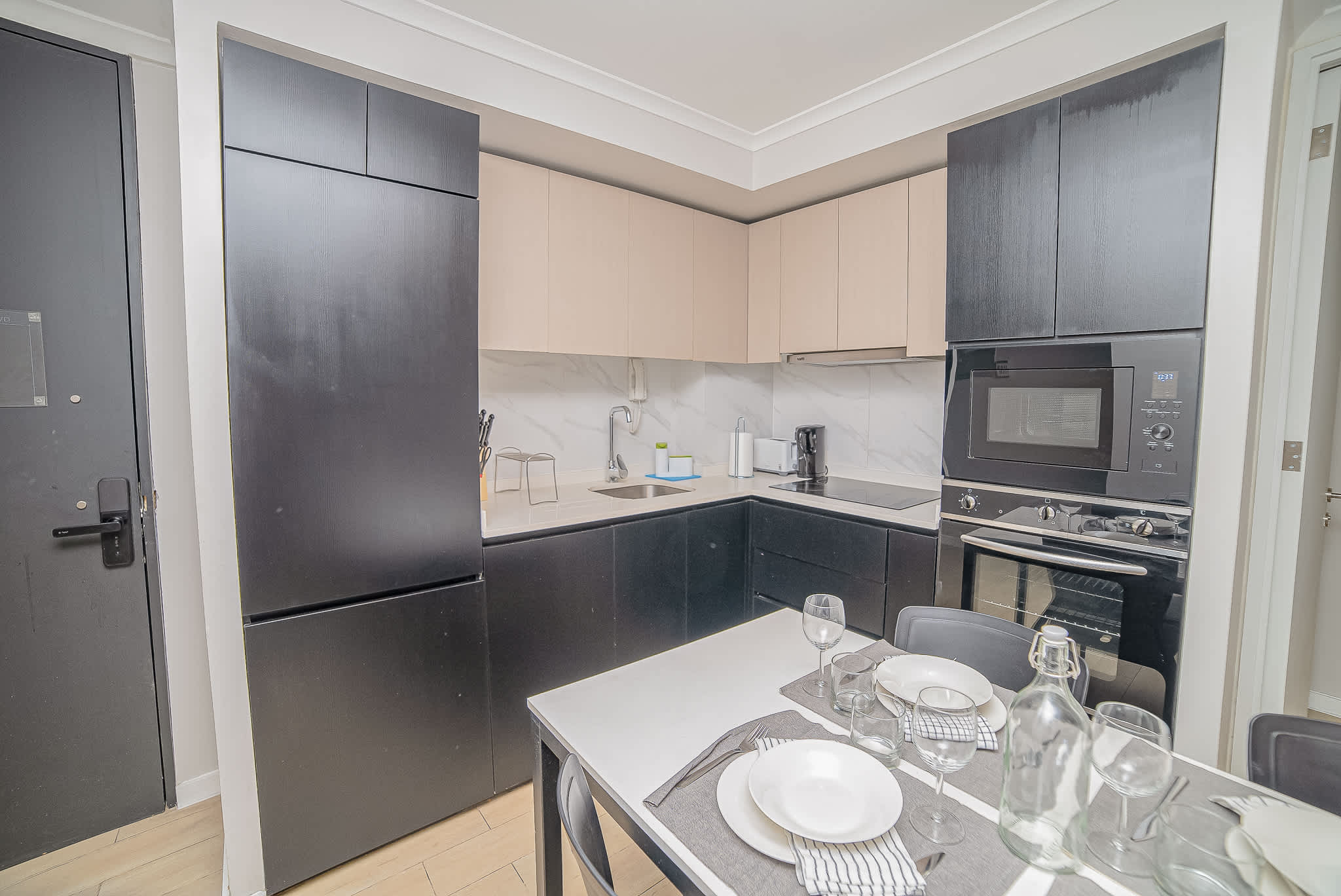 Sleek and modern kitchen with all the essentials for a cozy meal in your stylish Chilean apartment.