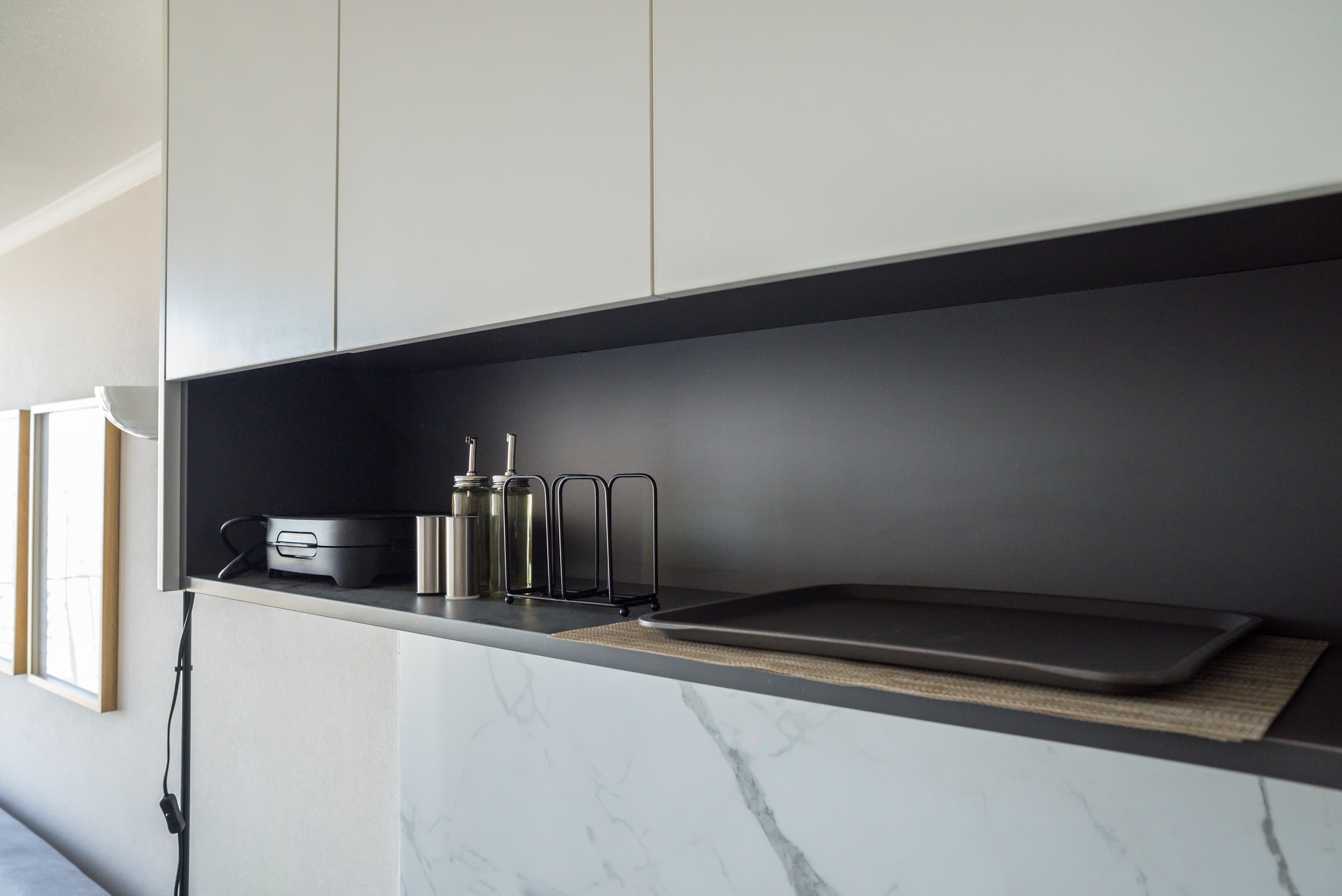 Sleek and modern kitchen with essential amenities, perfect for preparing meals in style.