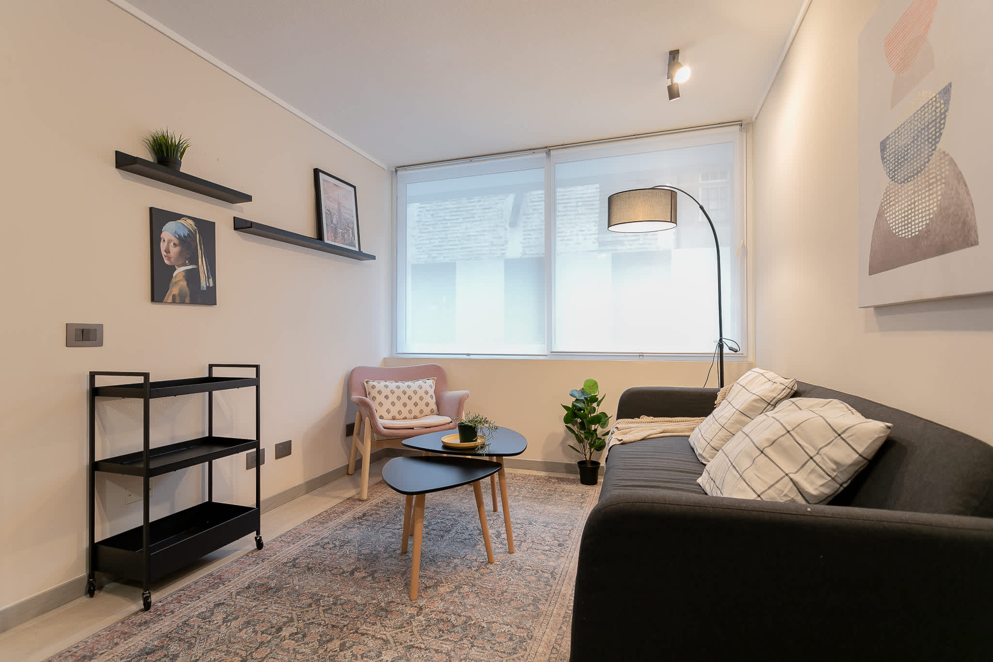 Bright and stylish living area with modern decor, perfect for relaxing after a day in the city.