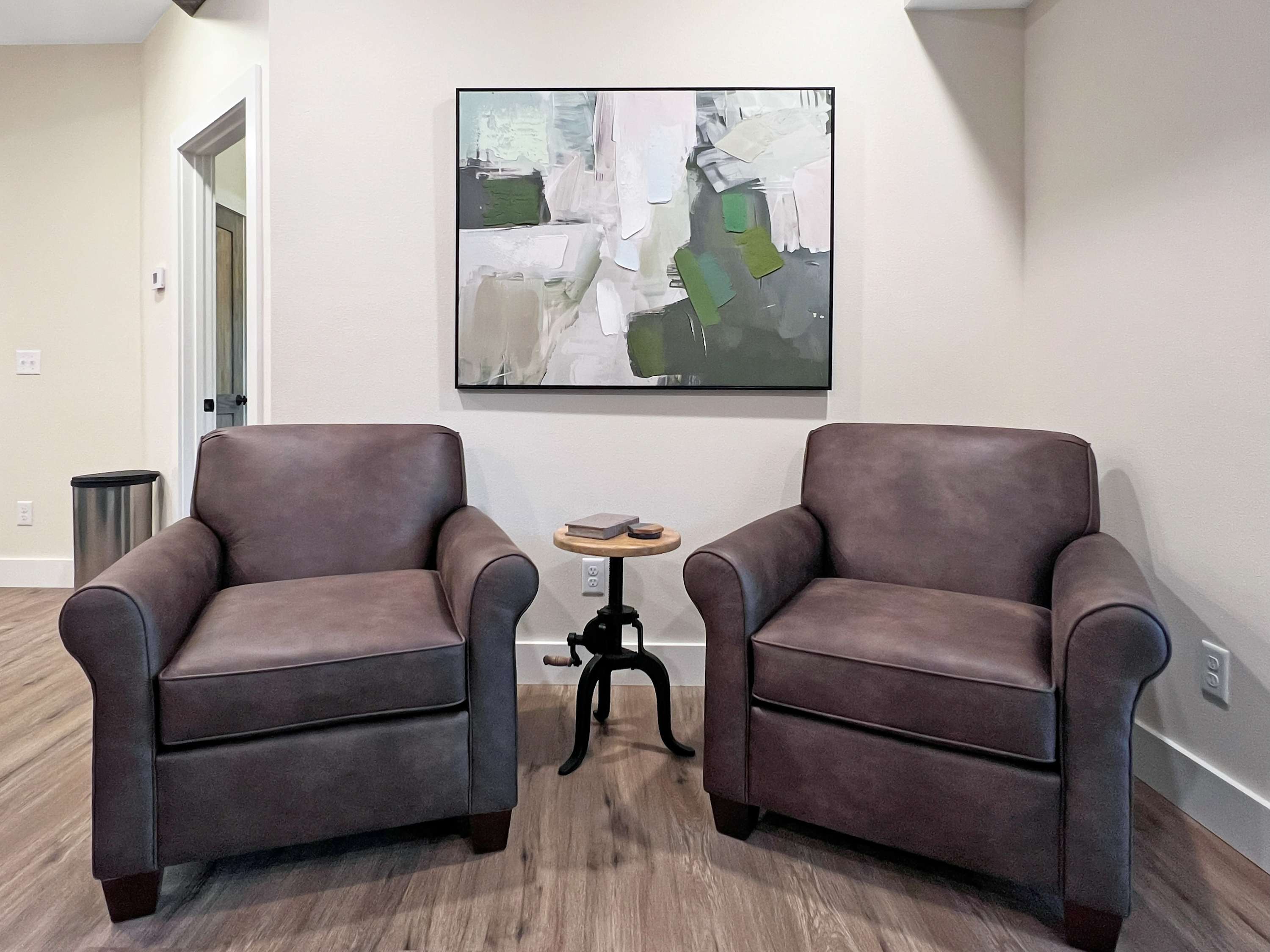 Comfy, reading nook with soft plush leather chairs to sink down into and forget the world outside