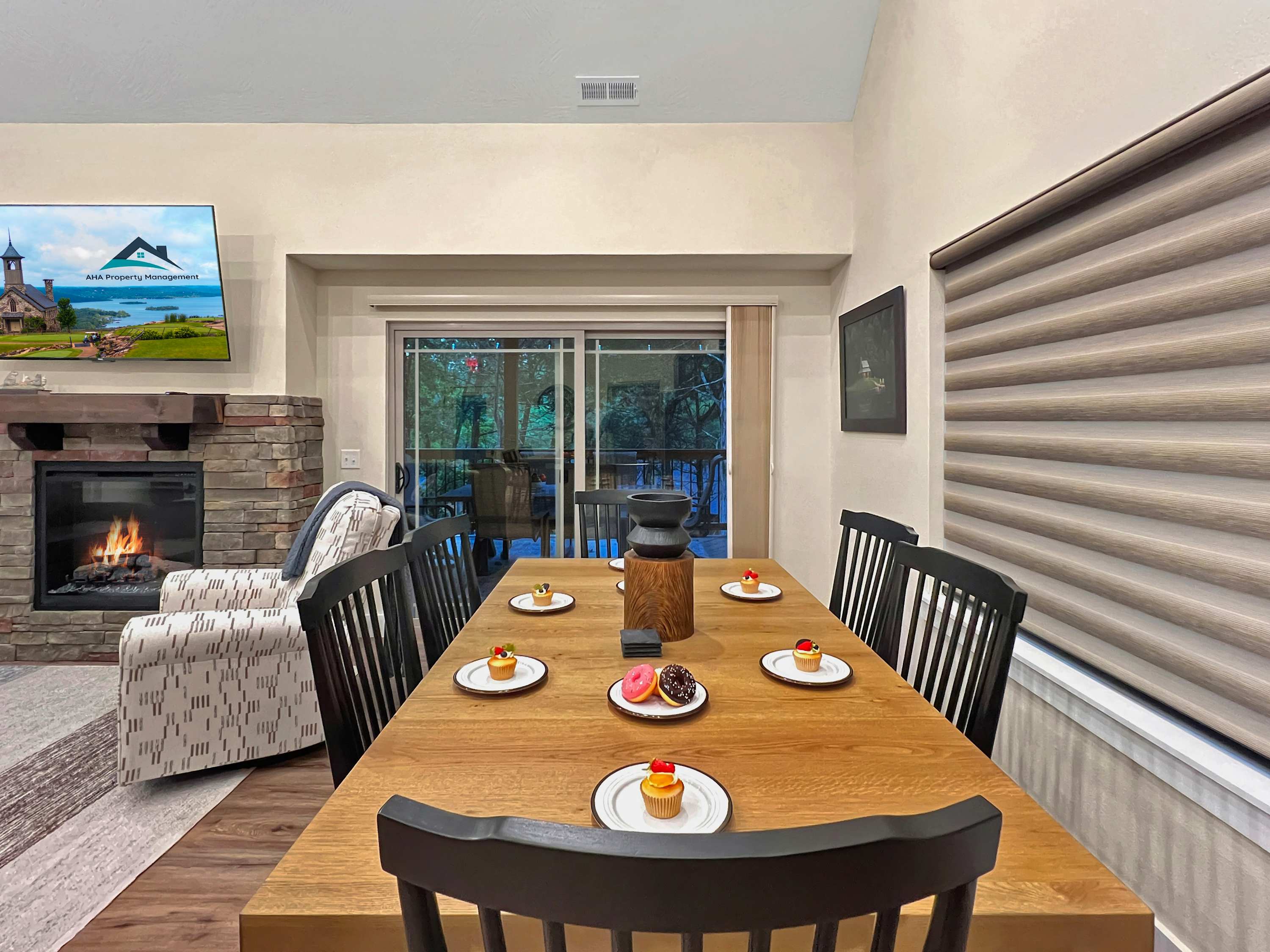 Plenty of dining space between the inside dining table, barstools and island and outdoor table and chairs on the deck.