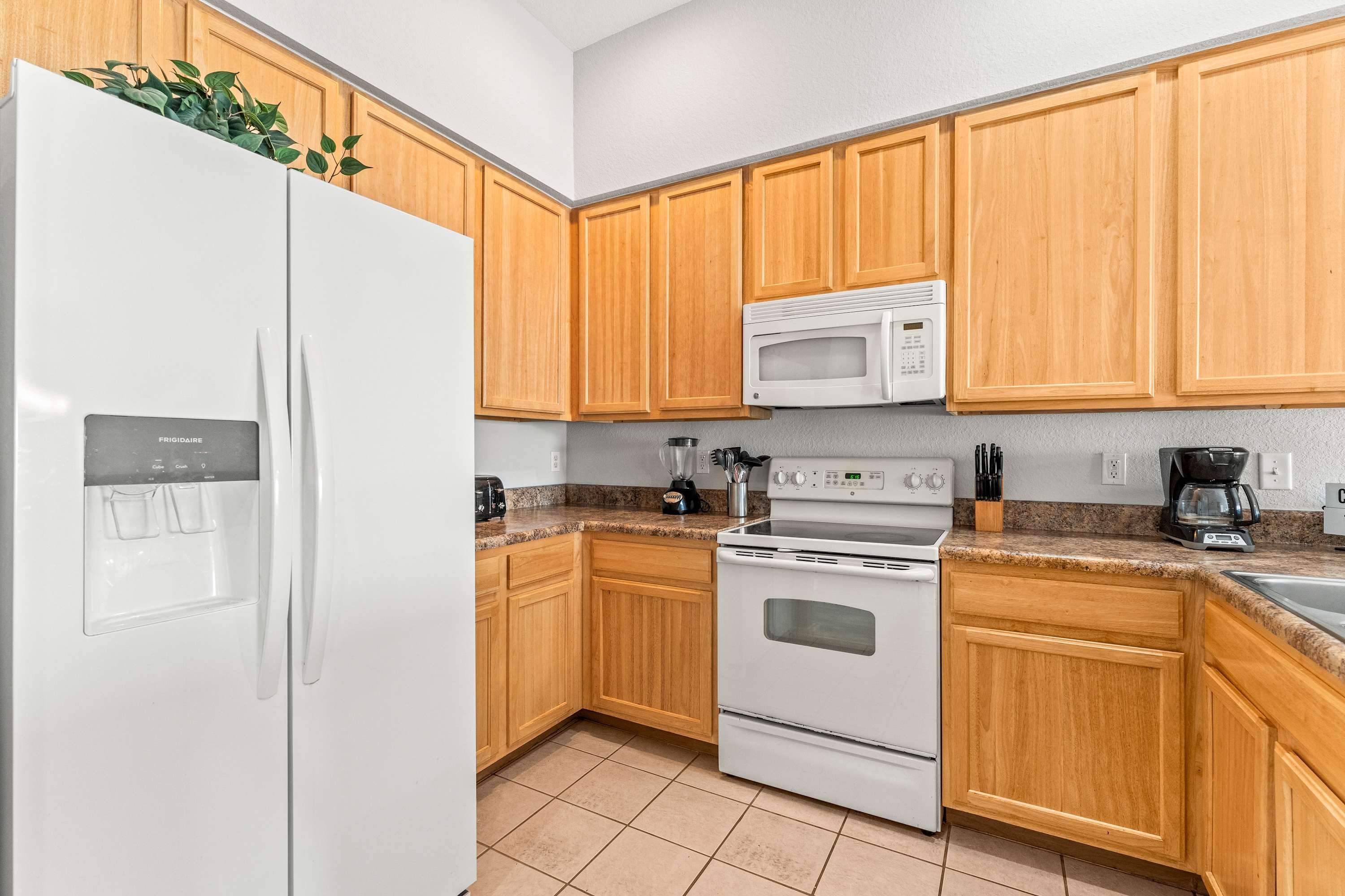 The open, airy kitchen offers ample space & every home comfort​