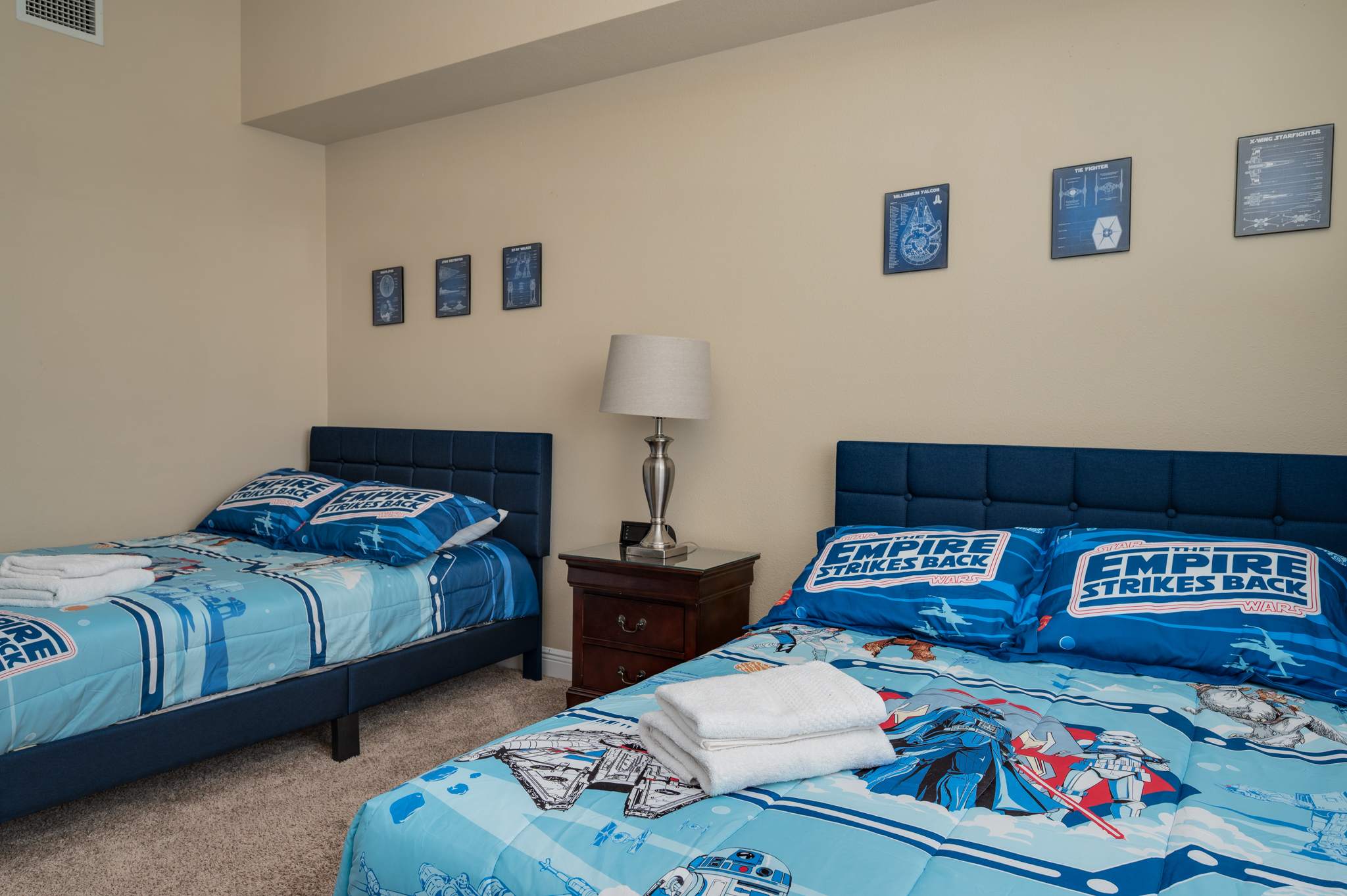 Calling all Jedis and Sith Lords! This fun Star Wars themed bedroom is ready for an epic adventure with two comfortable full beds.