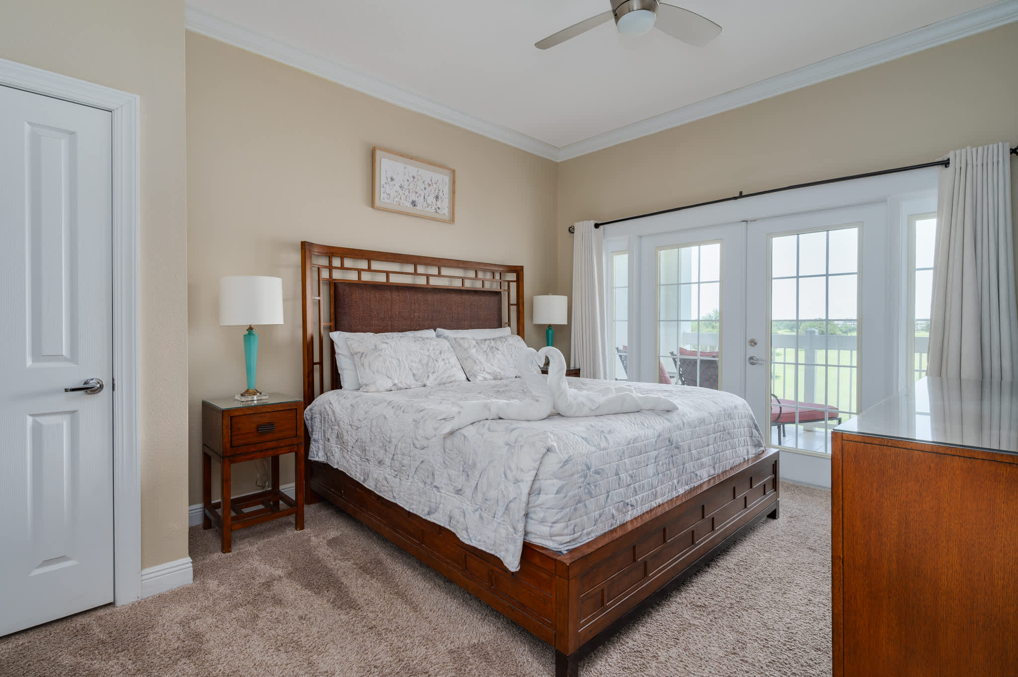 Wake up to beautiful views and step out onto your private balcony from this comfortable primary bedroom