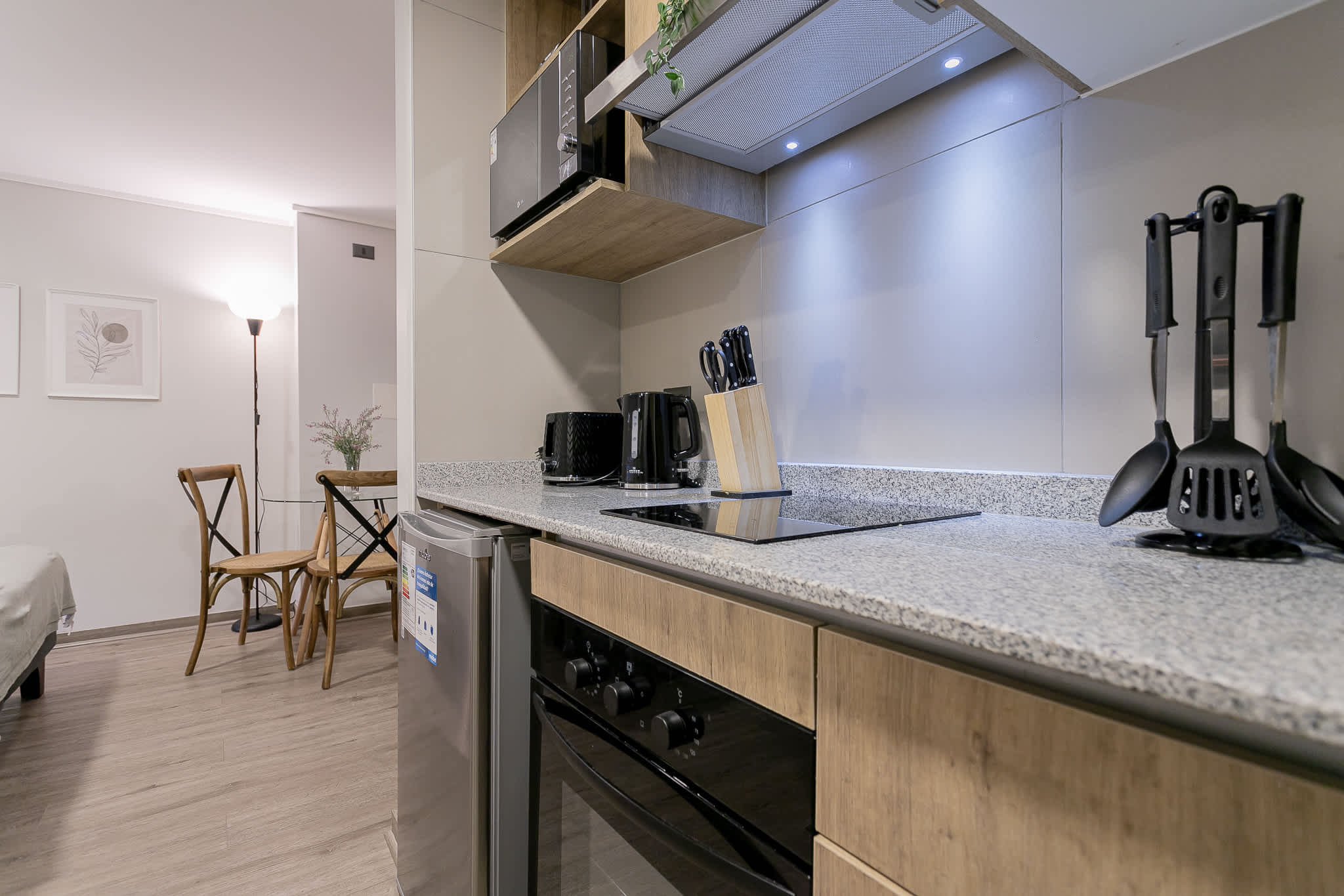 Cozy and modern kitchen with all essentials, perfect for a quick meal or a romantic dinner for two.