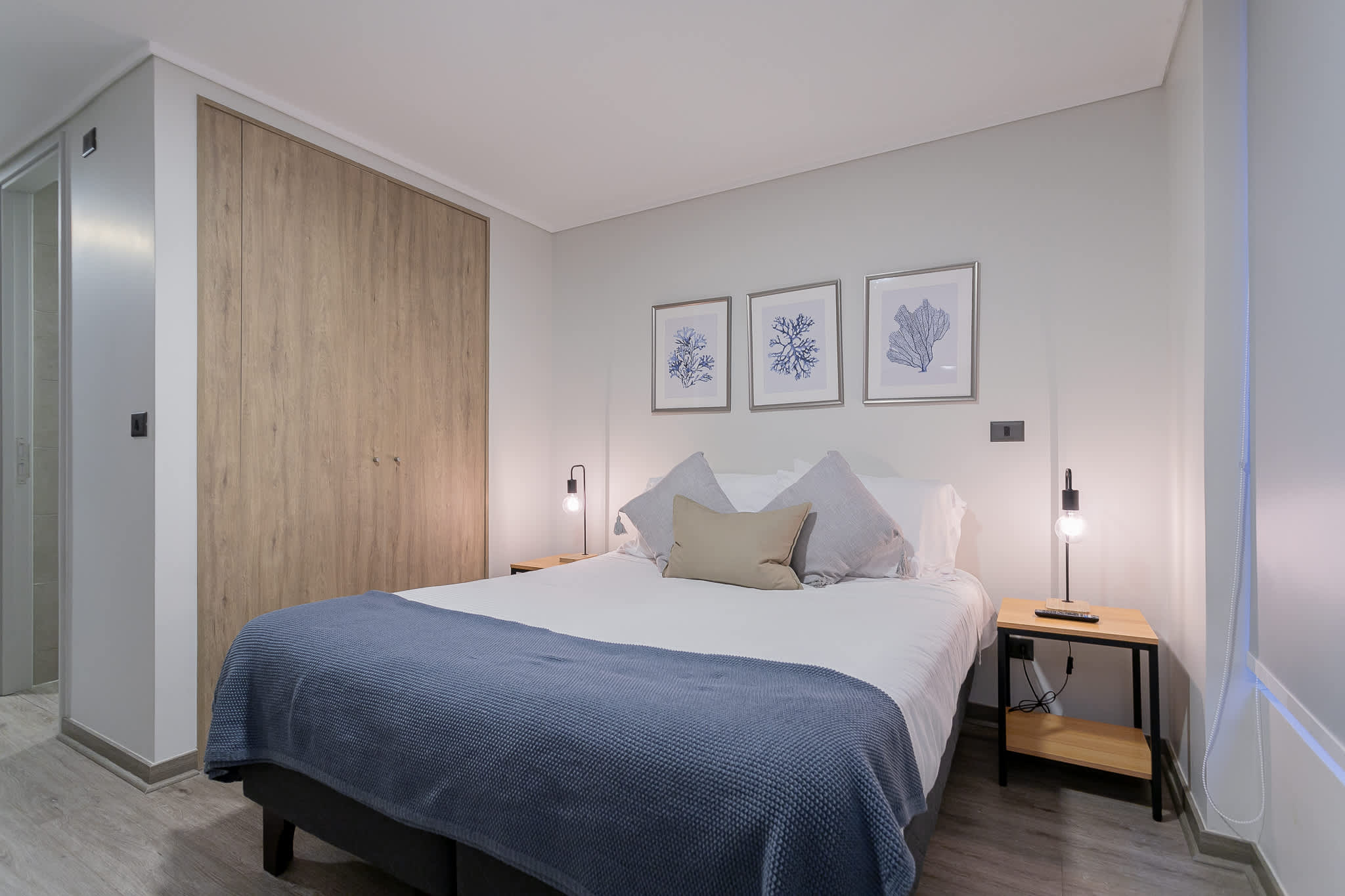 Relax in this stylish and cozy bedroom, complete with modern decor and soft lighting for a restful stay.