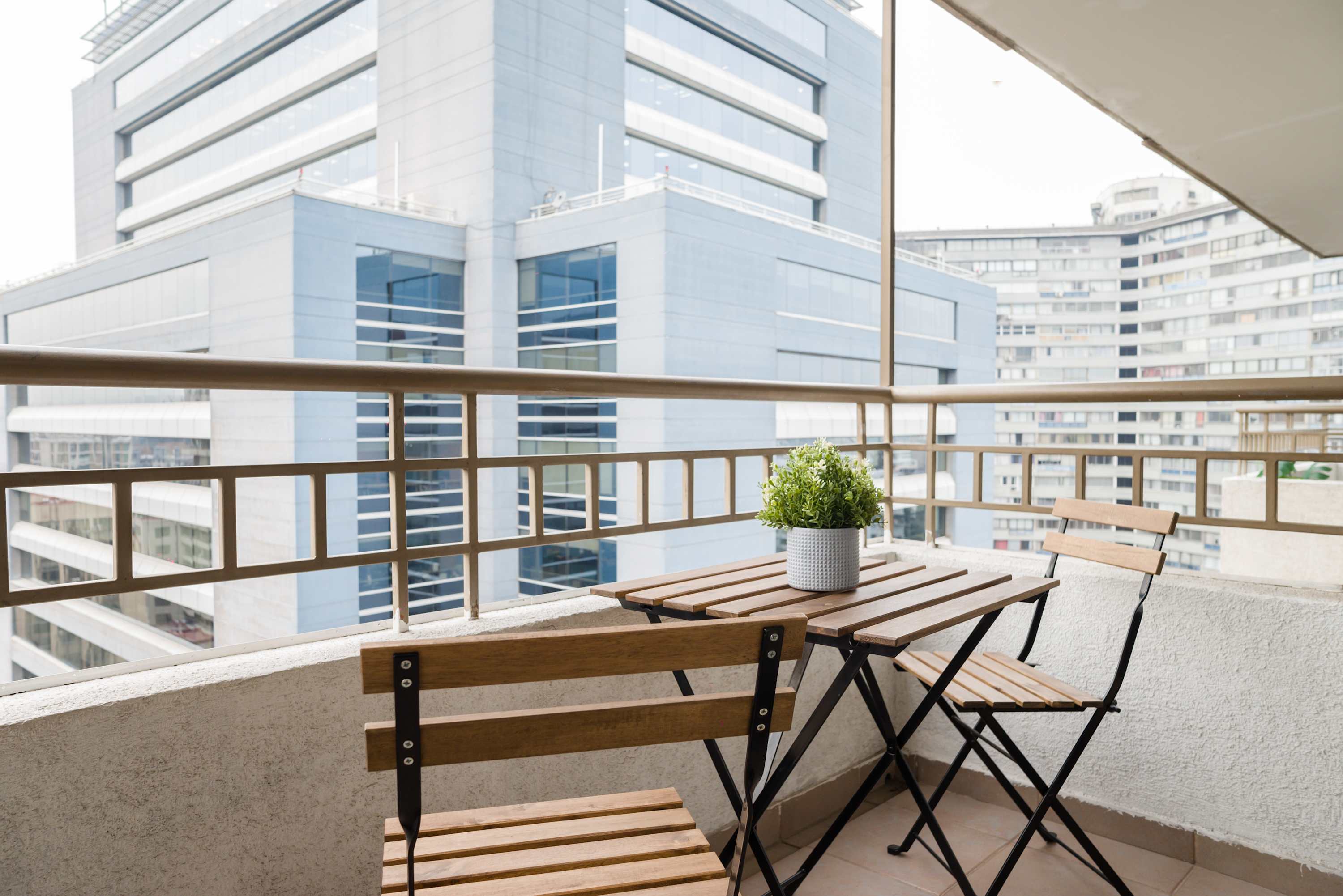 Enjoy a relaxing morning coffee on your private balcony with a cityscape view.