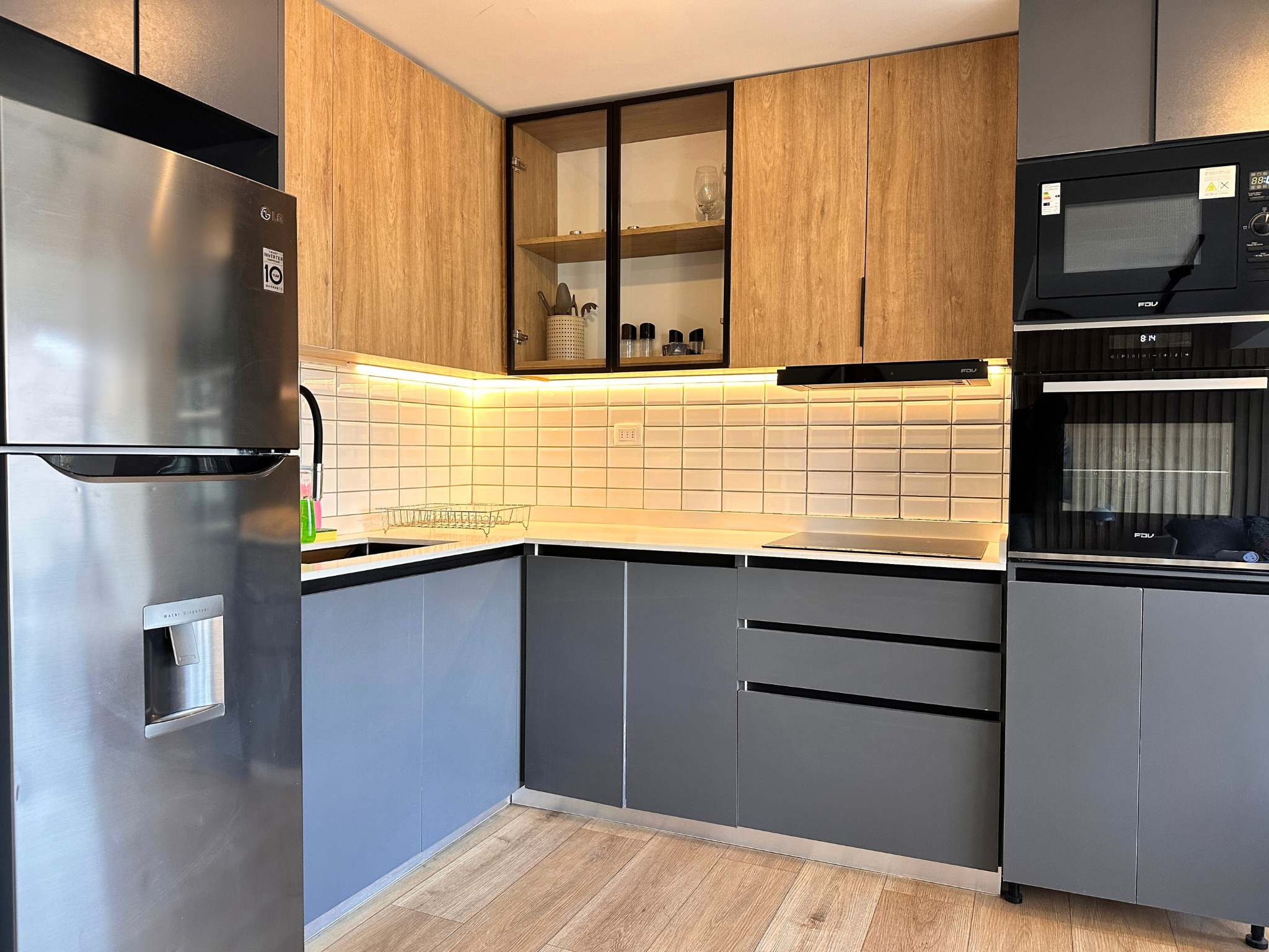 Sleek and modern kitchen with top-notch appliances, perfect for cooking a cozy meal in your Chilean studio retreat.