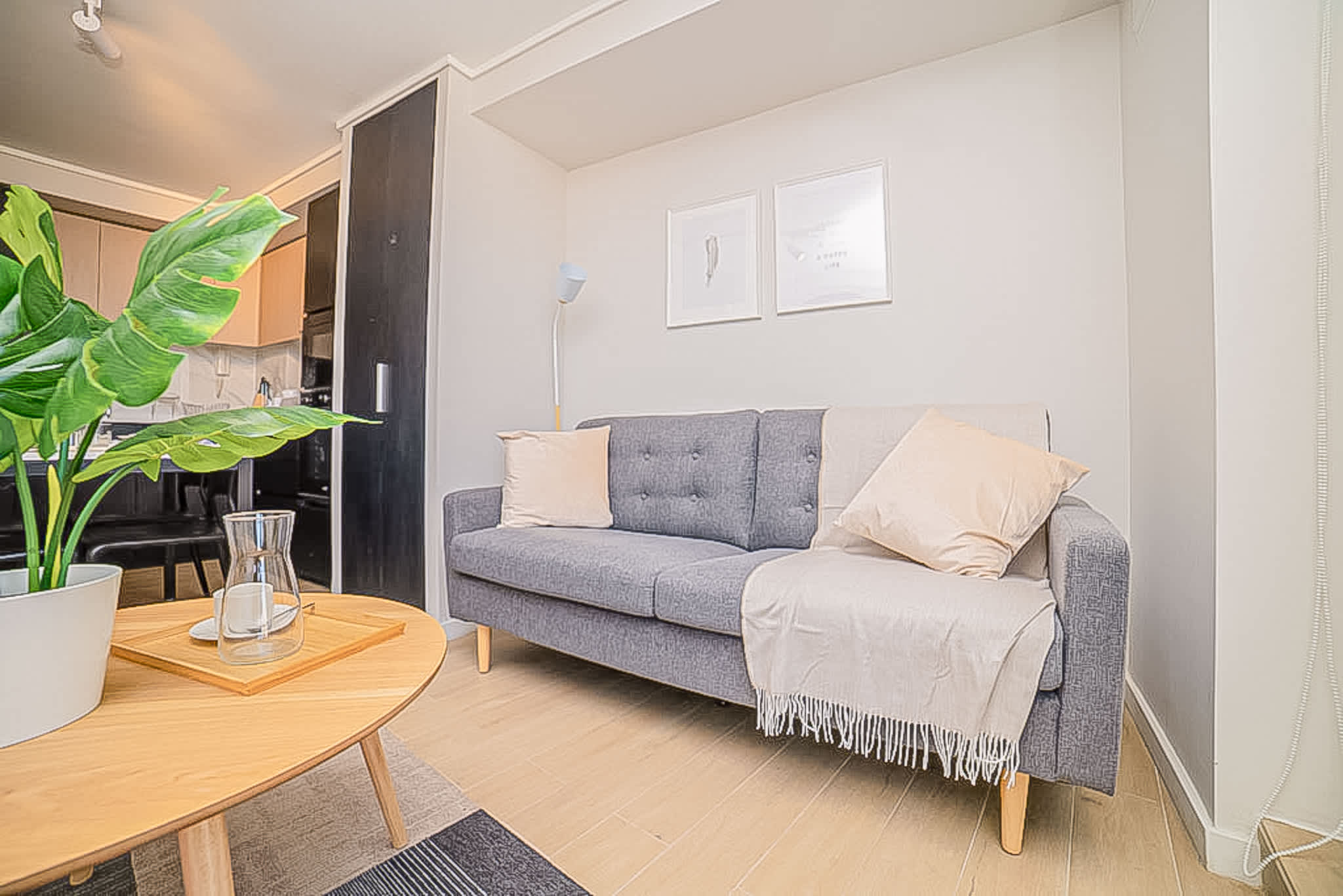 Relax in this stylish living area with a cozy sofa and modern decor, perfect for unwinding after exploring the city.