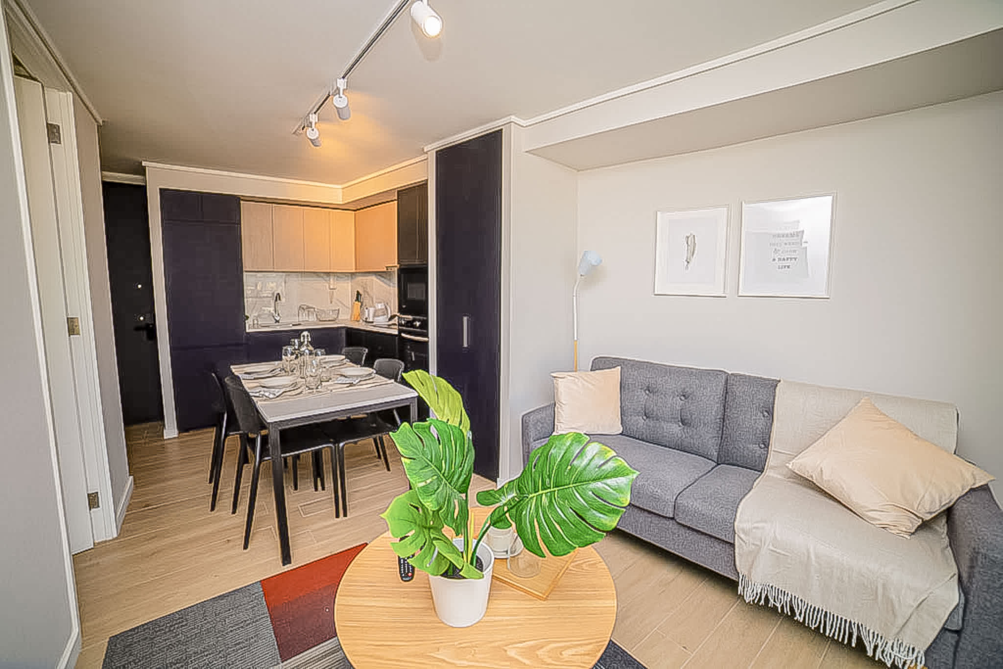Experience comfort in this stylish studio with a cozy living area and modern kitchen, perfect for a relaxing stay.